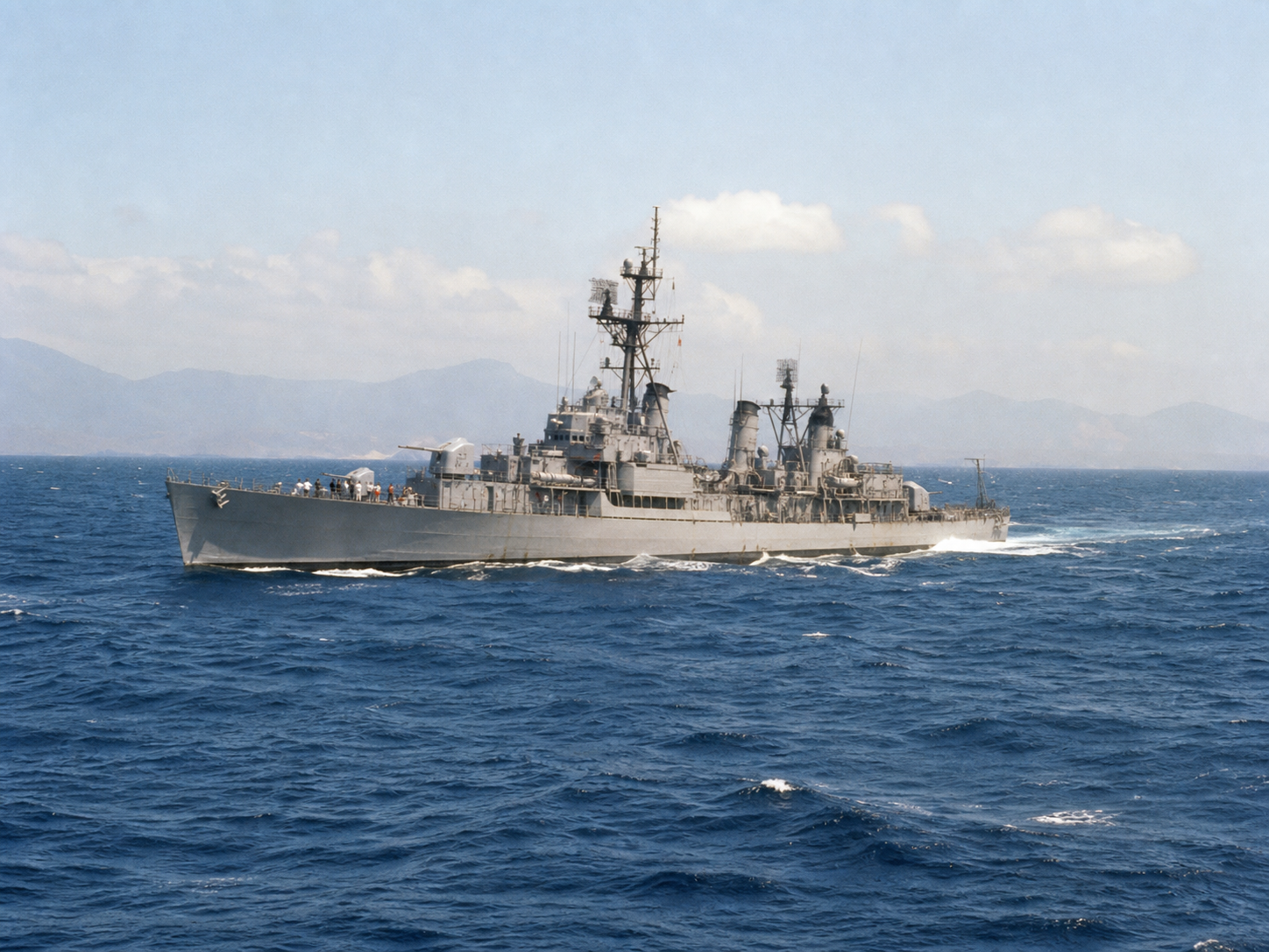 Vietnam-era Navy warship on the open ocean representing Blue Water Navy service