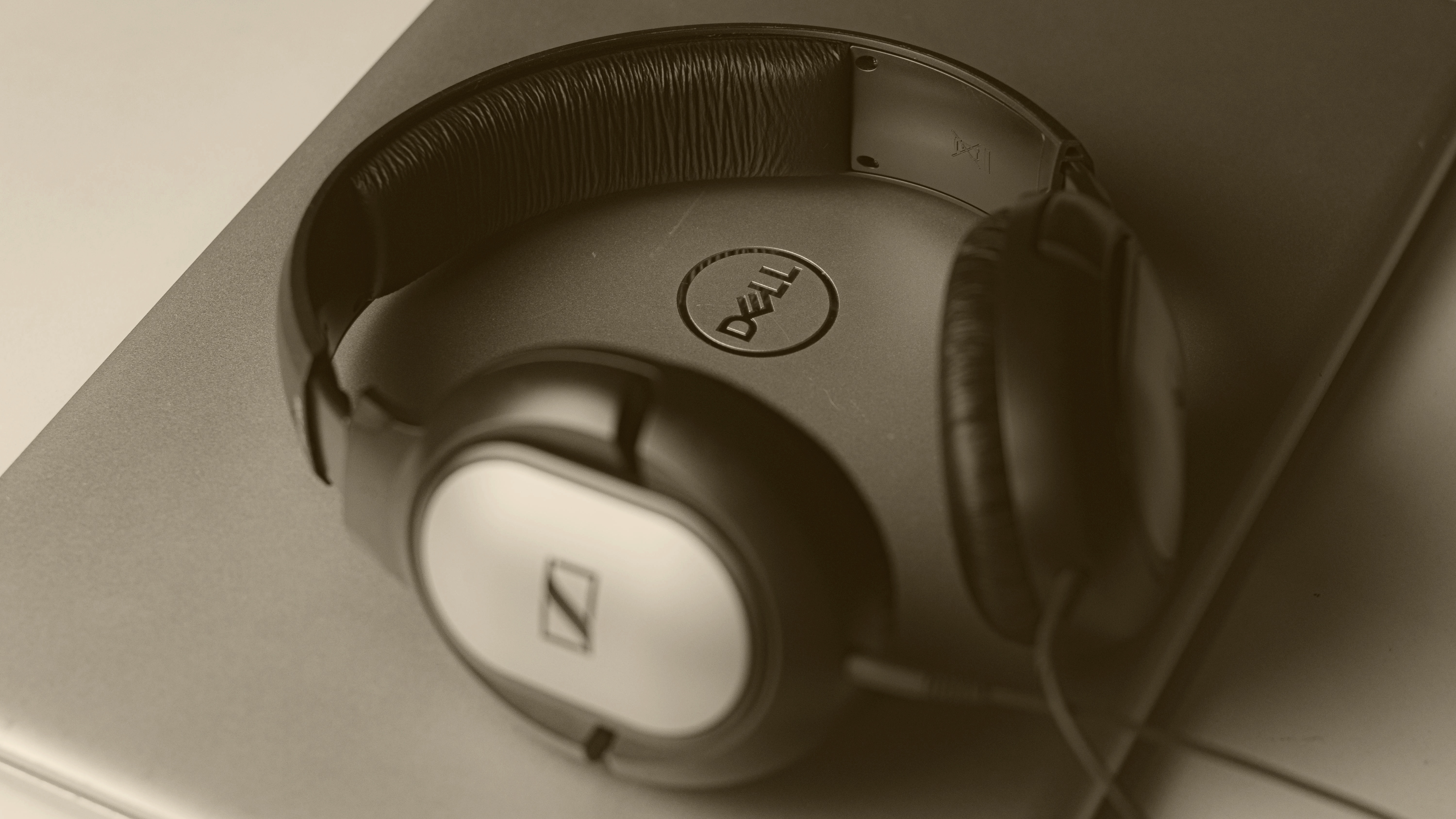 Luxurious headphones resting on velvet in golden light