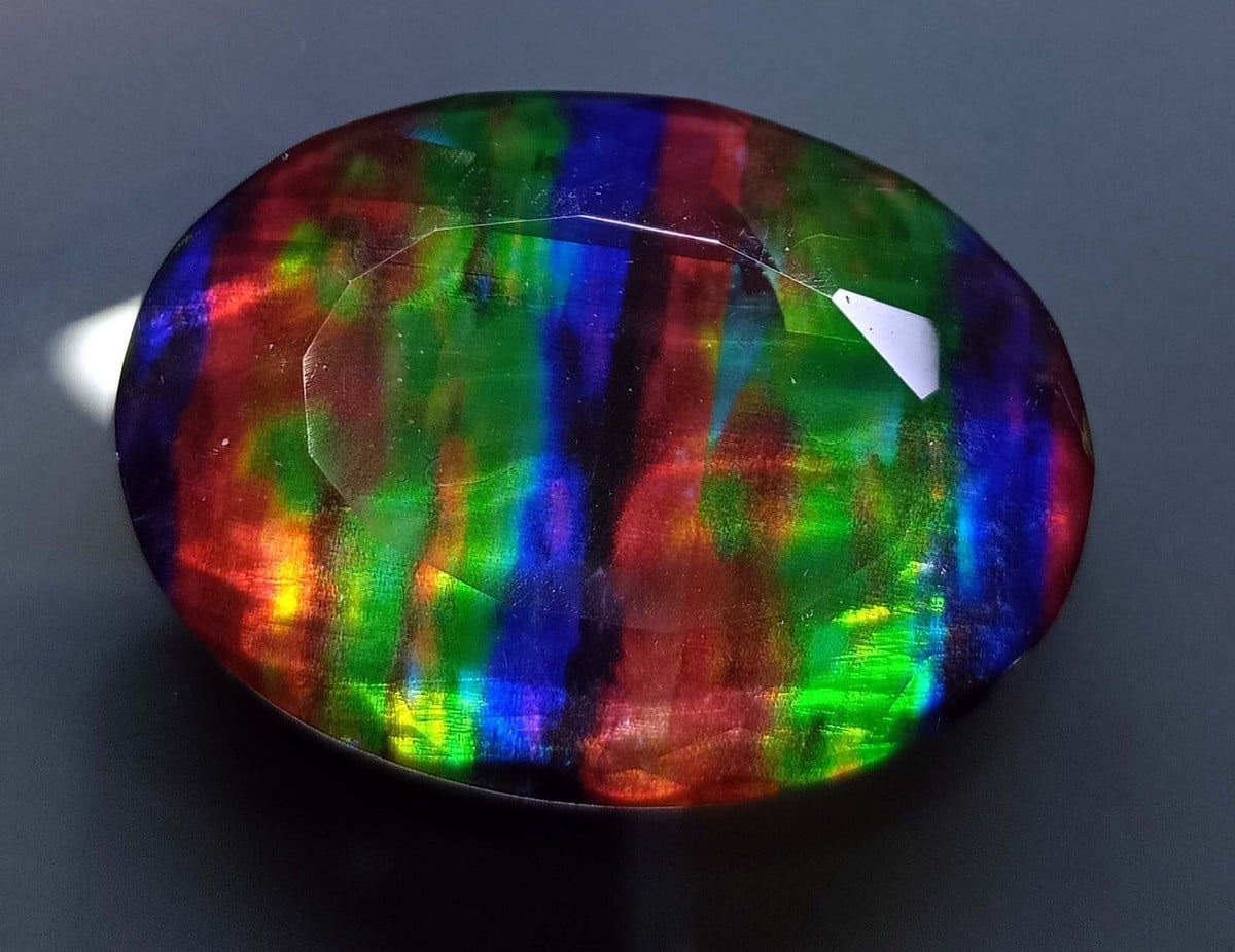 Iridescent rainbow ammolite gem