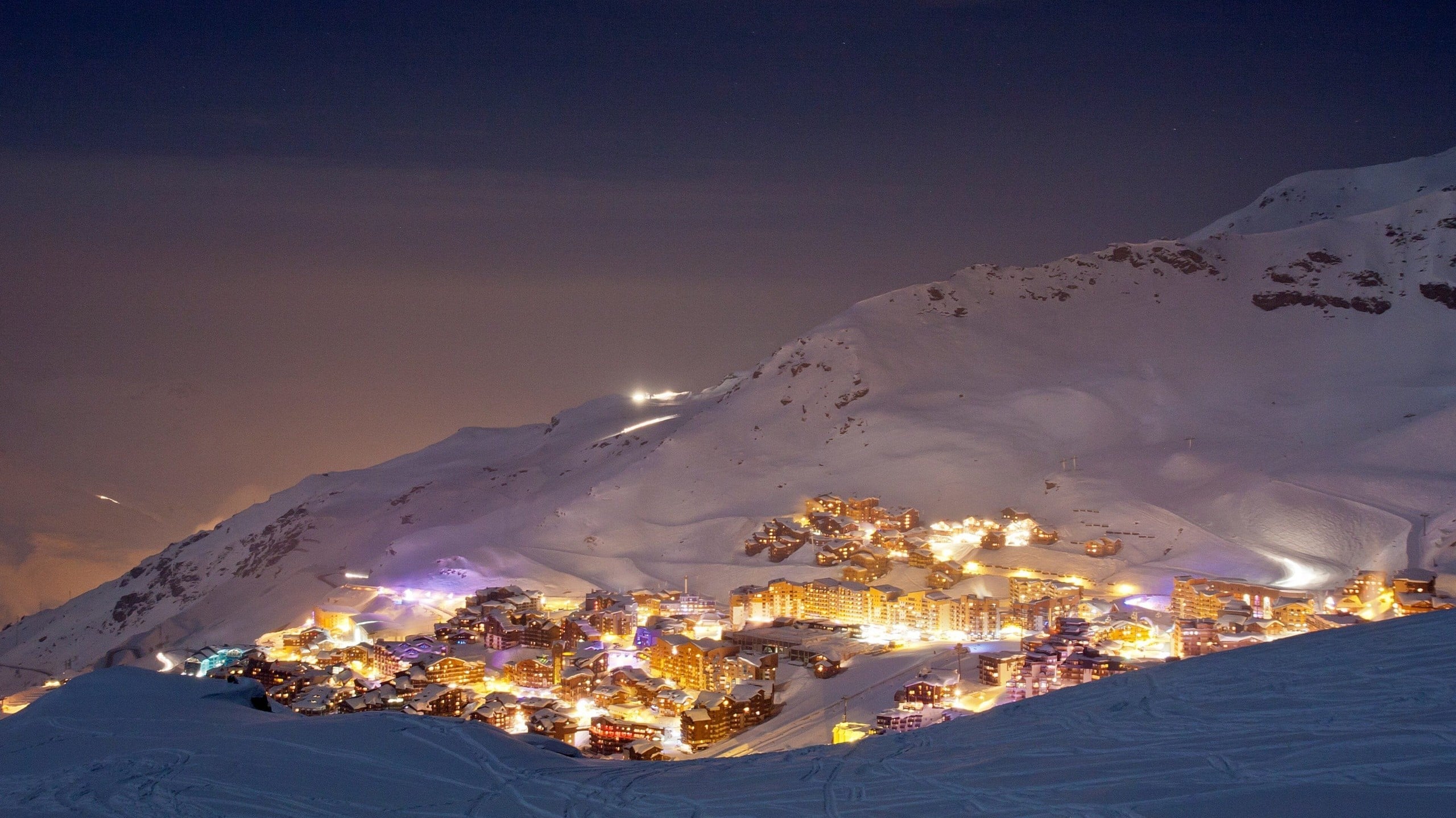 Val Thorens village lit up on a winter evening