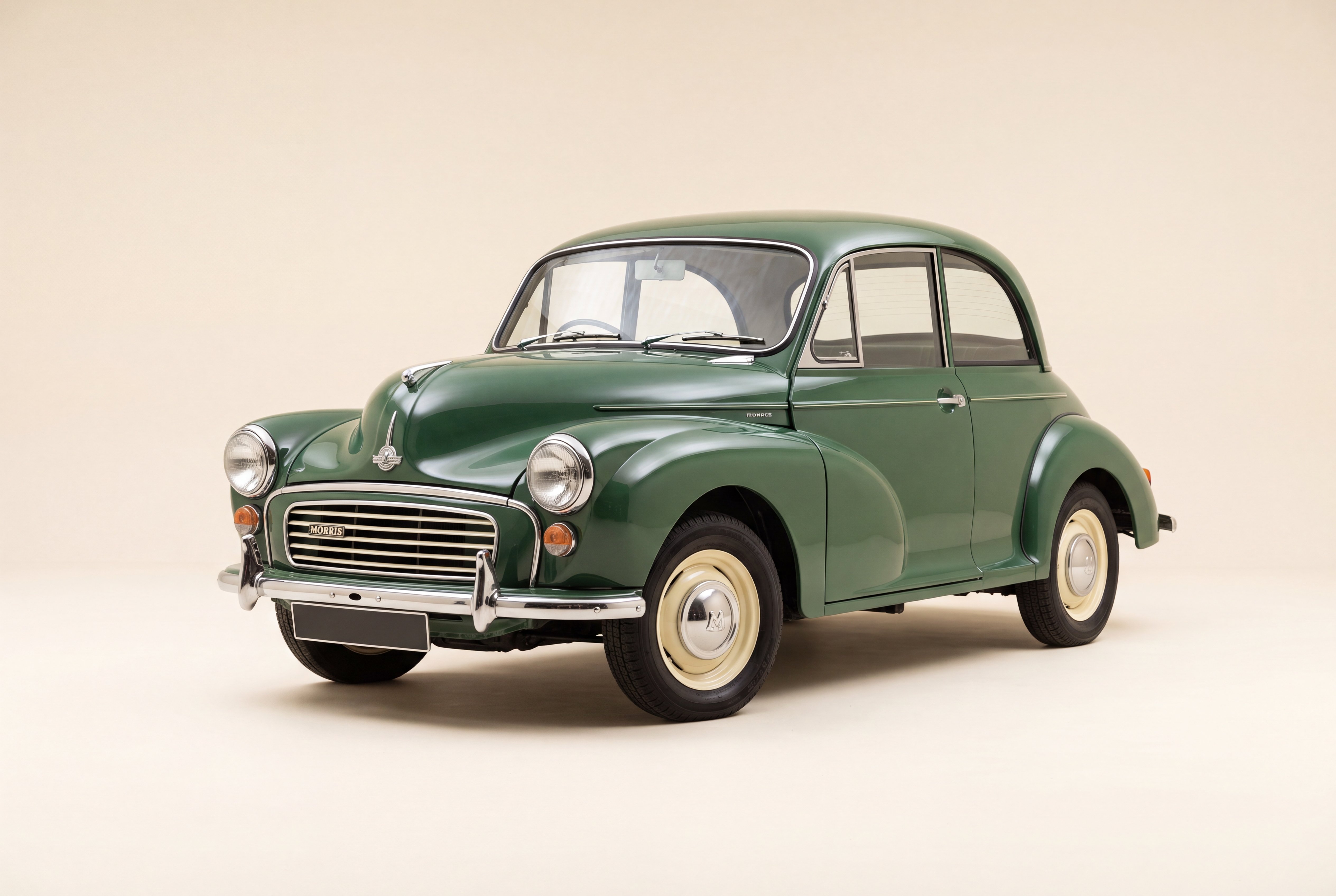 1967 green Morris Minor on a clean cream studio background