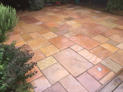 Clean garden patio after expert pressure washing service in York, Newcastle, and Cambridge