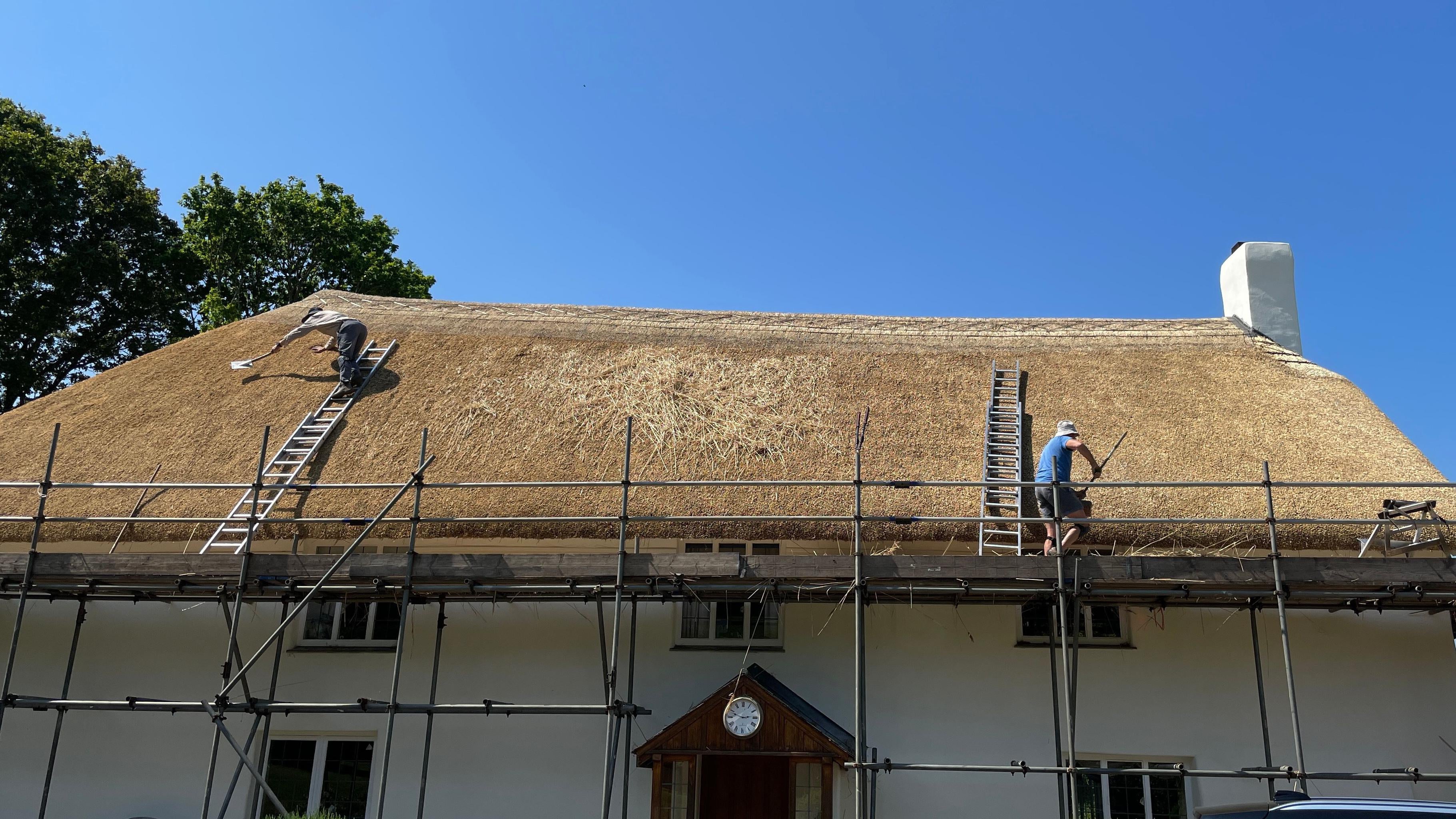 Traditional thatched roof repair in UK
