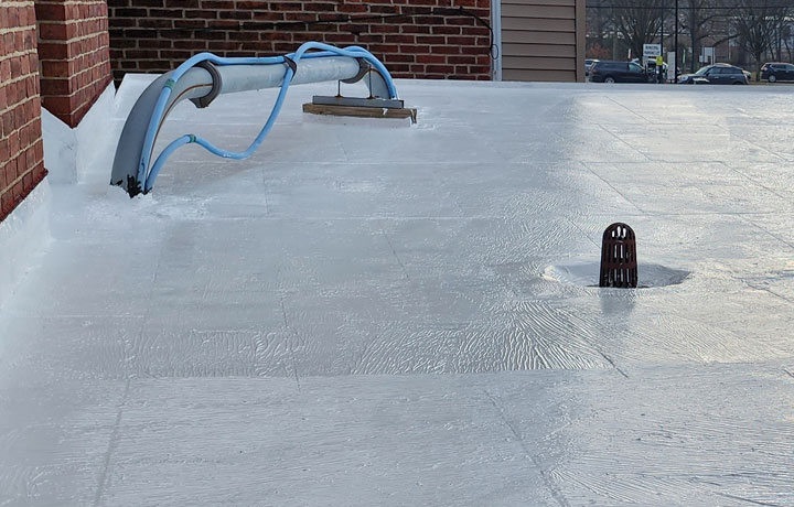 Flat roof coating application