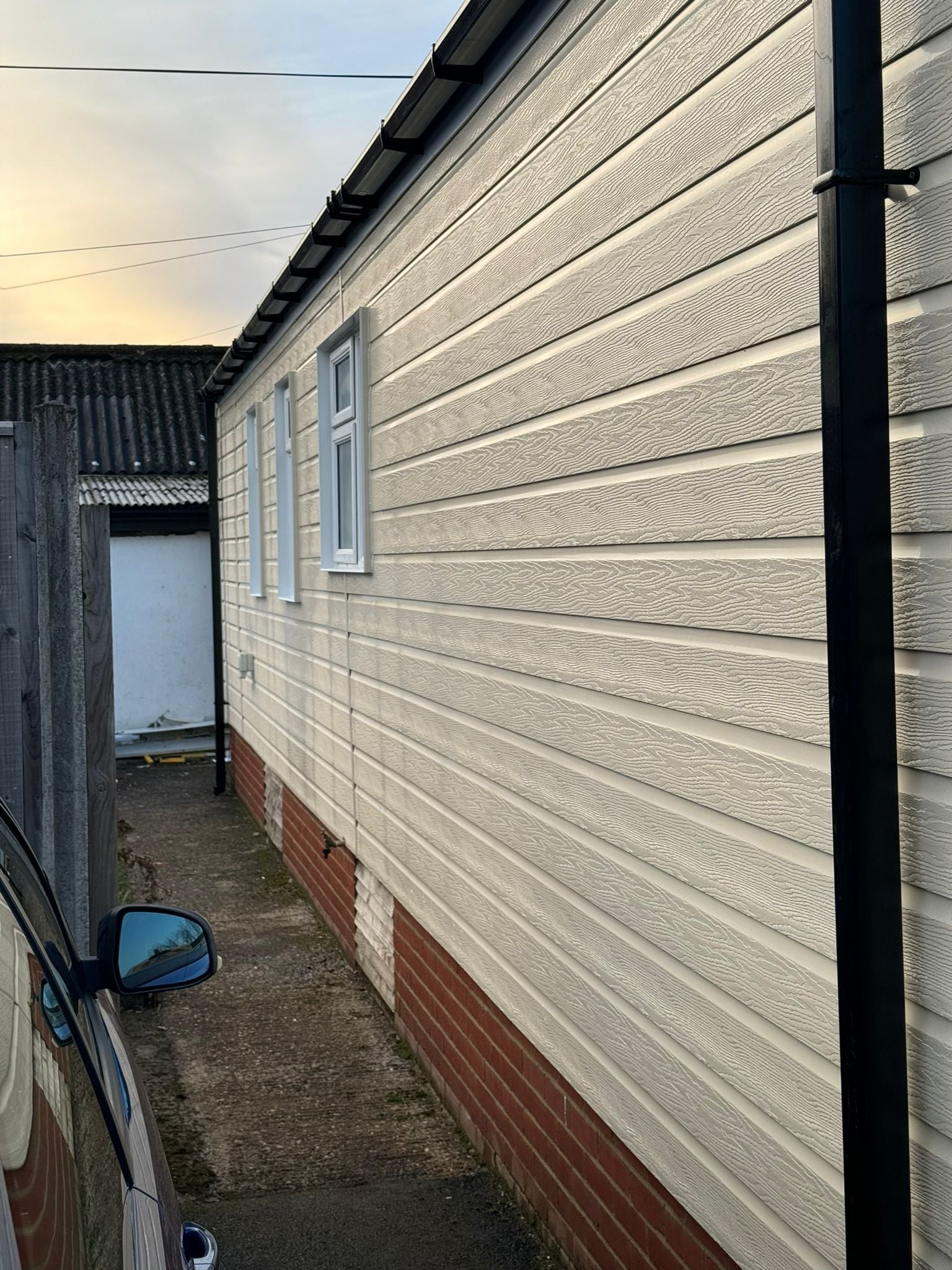 Xtratherm insulation boards being fitted to park home exterior with exposed timber frame