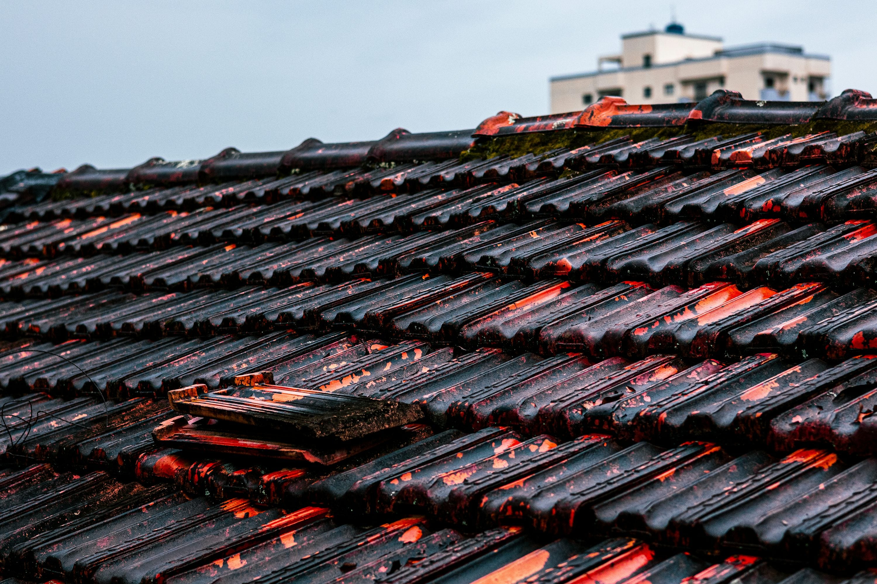 Roof with missing tiles after a storm