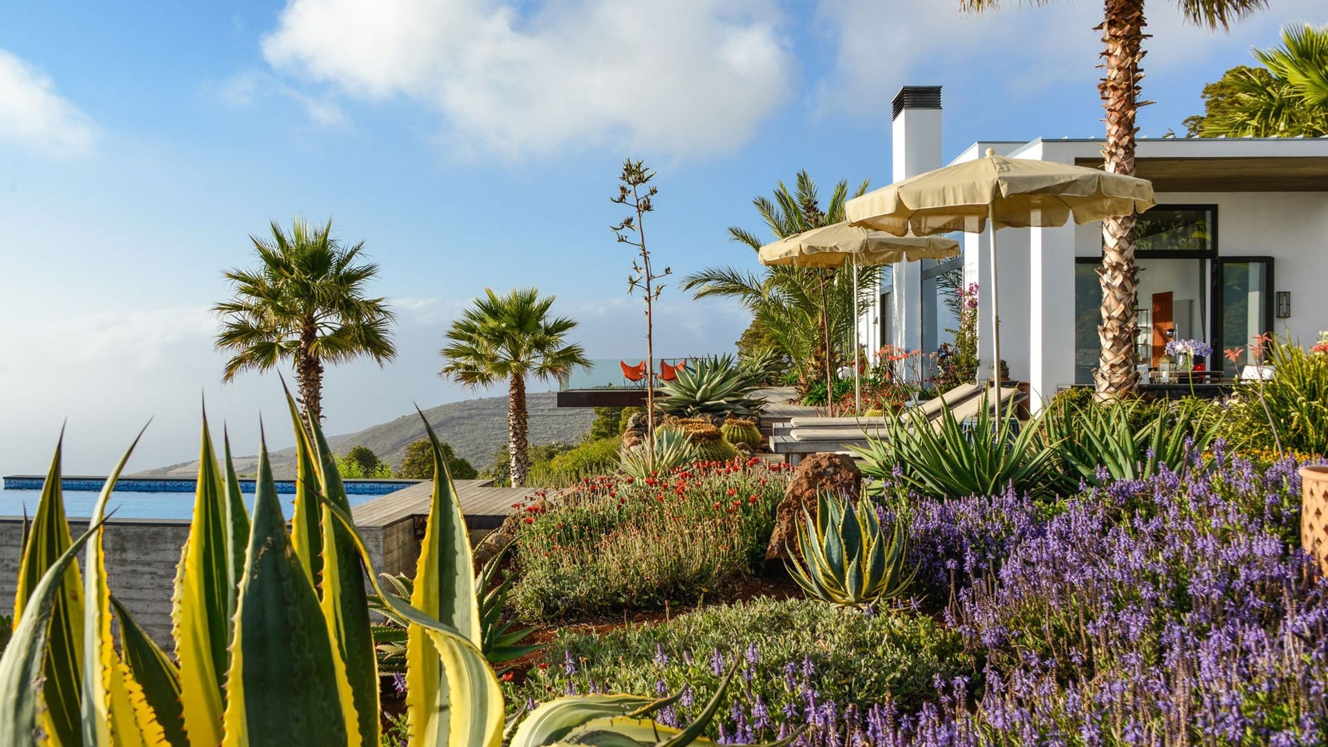 Villa exterior with volcanic hillside setting