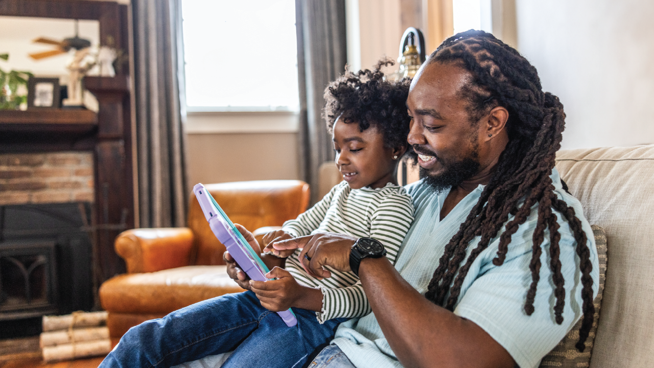 Concerned parent monitoring their child's phone activity for signs of online grooming