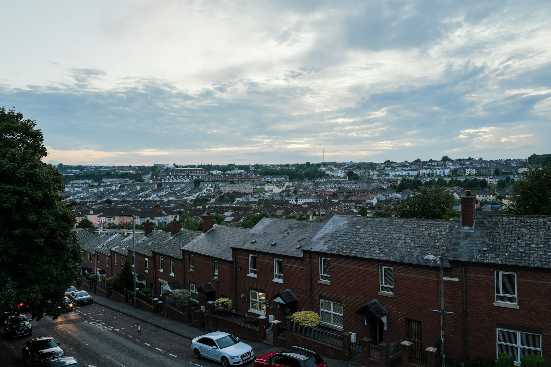 Terraced streets under stormy skies