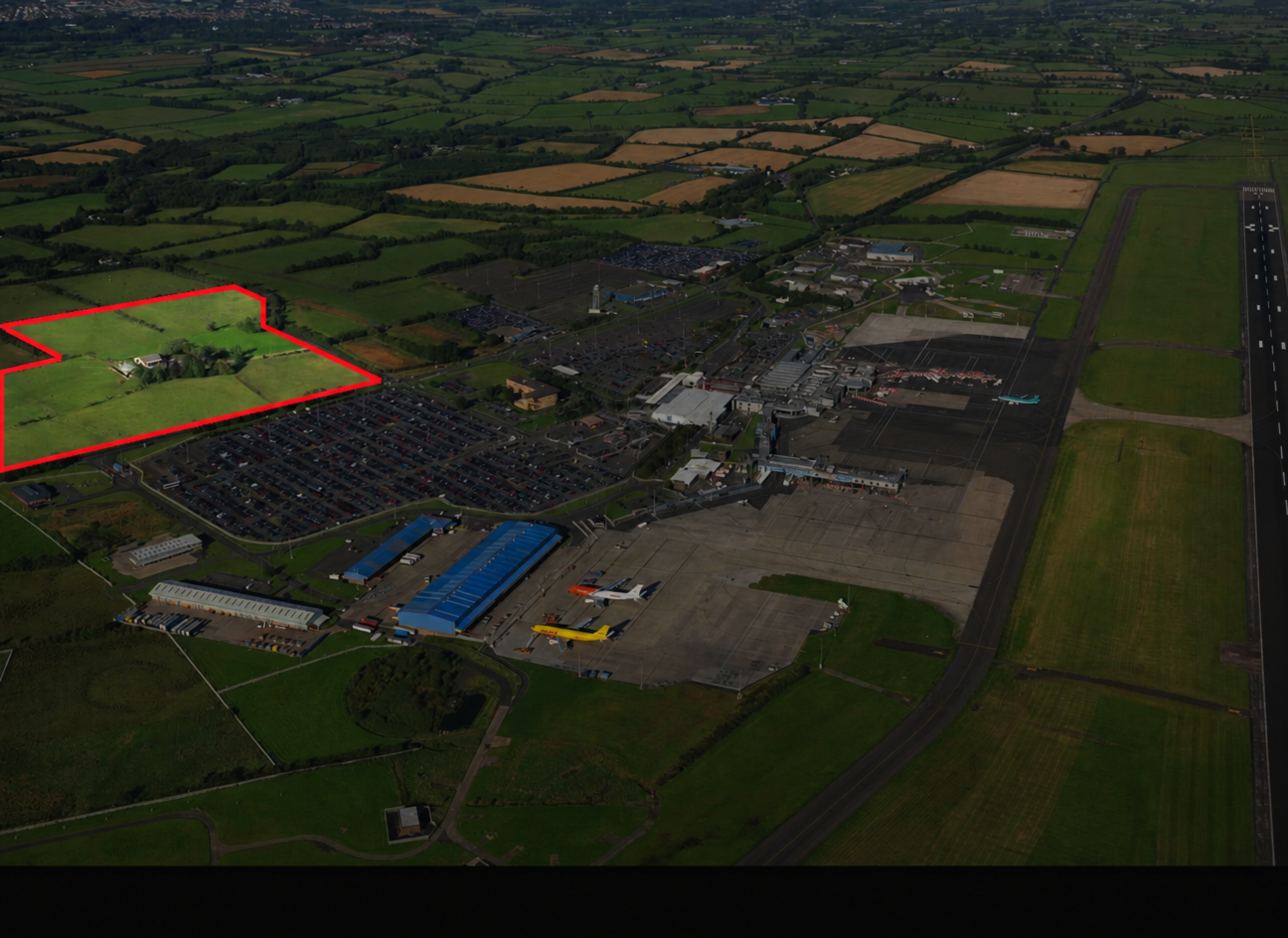 Aerial view of Belfast International Airport and surrounding development land