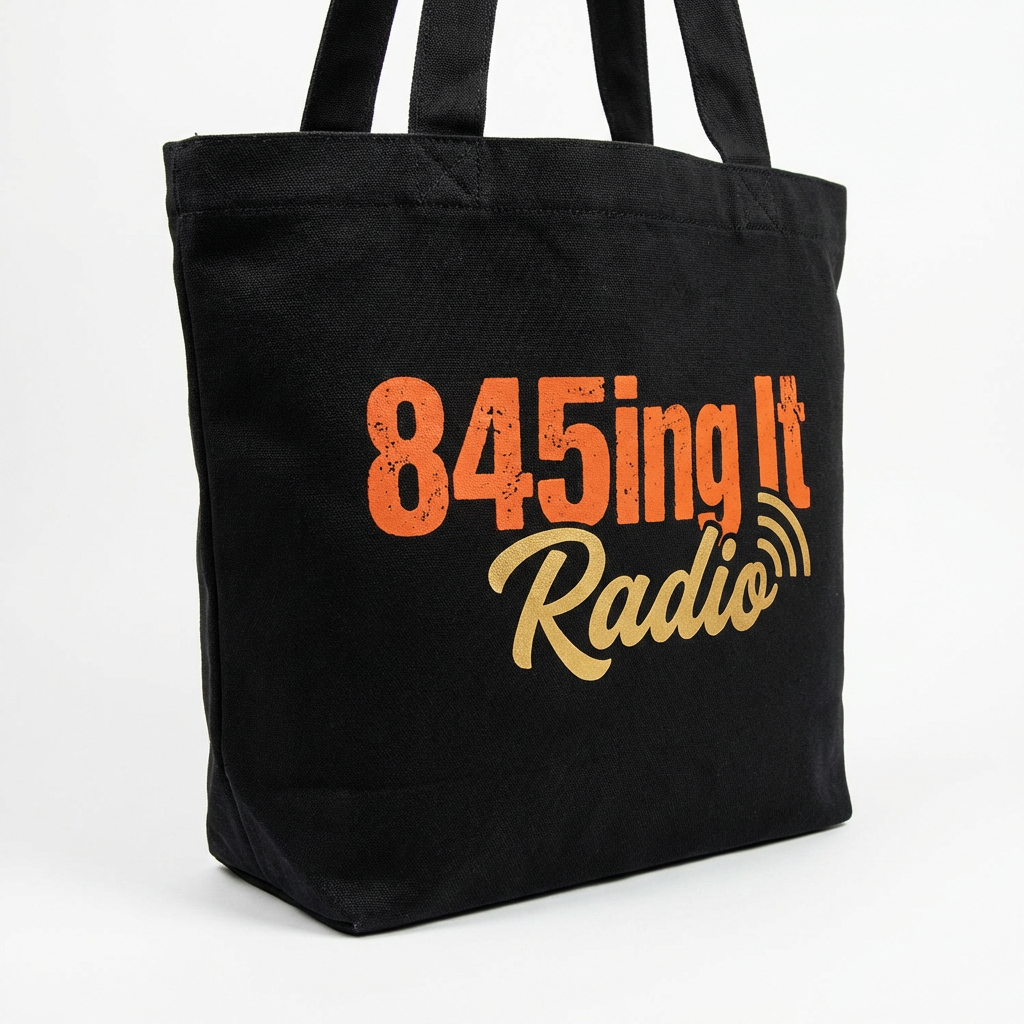 Black canvas tote with bold orange and gold print