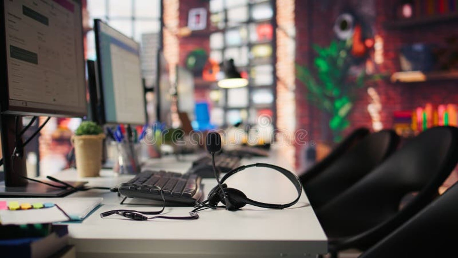 Multiple monitors displaying analytics dashboards and data charts