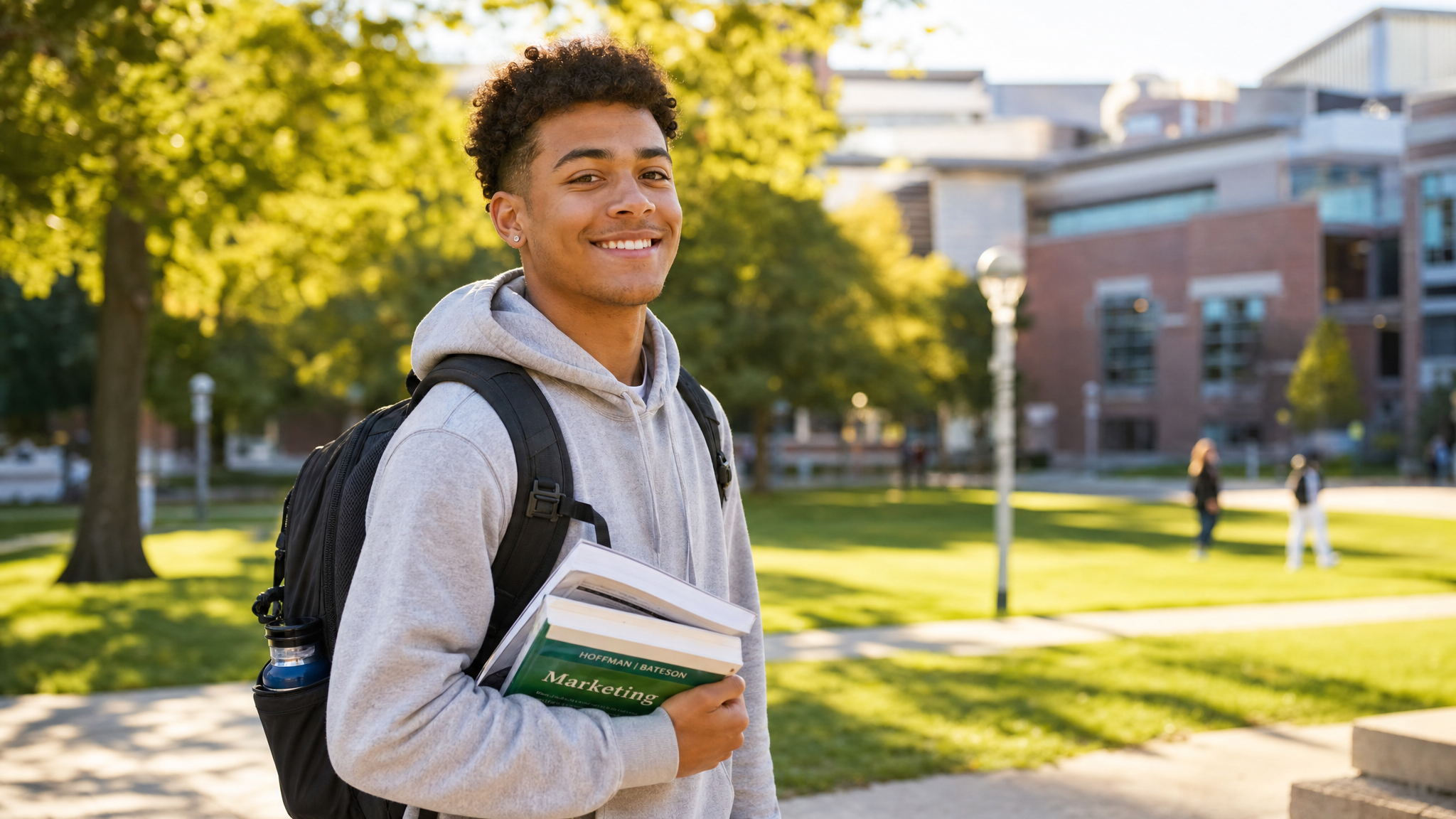 A young mixed-race Black college student with a backpack and books on a sunny campus