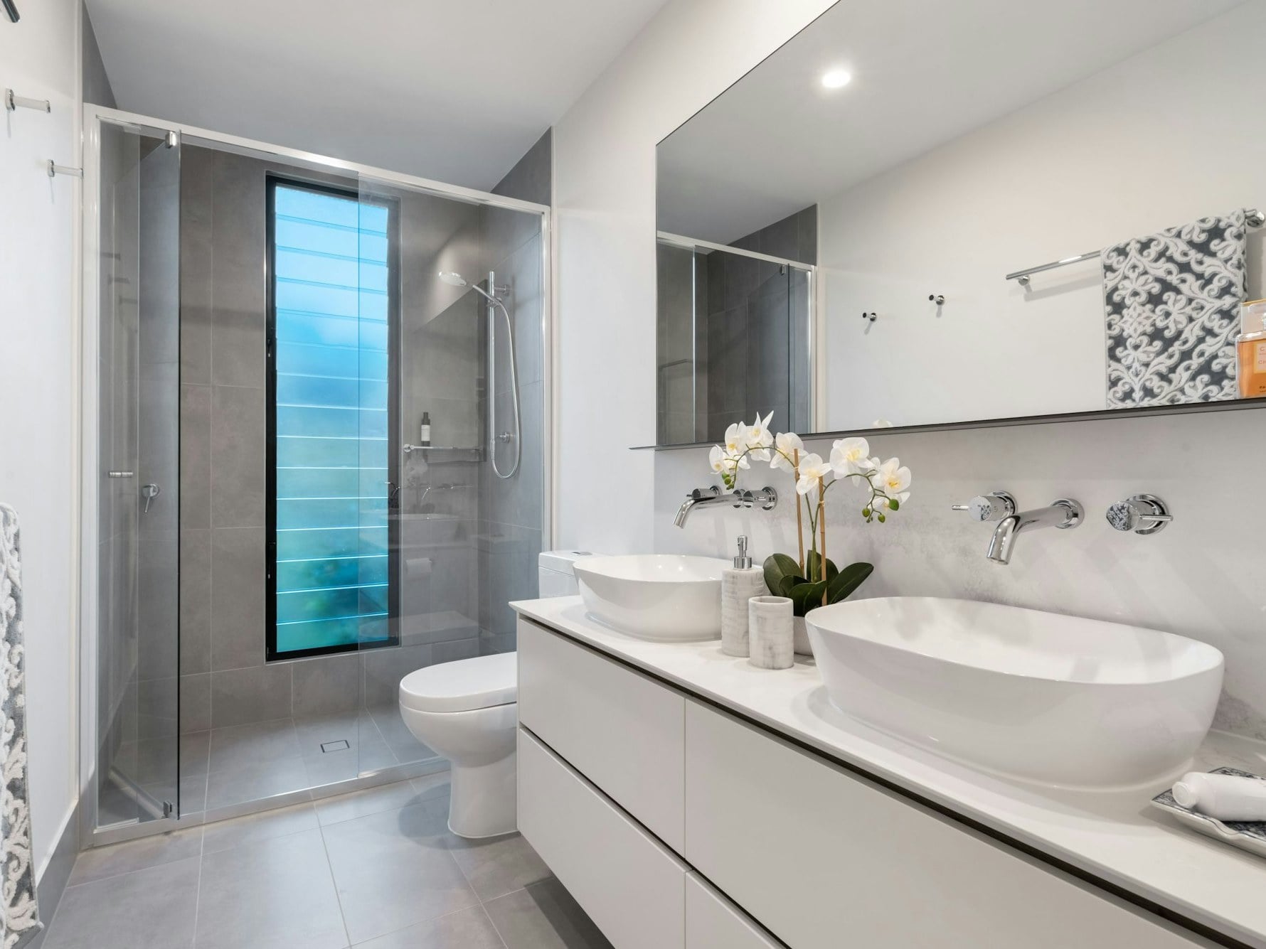 Modern tiled bathroom with walk-in shower renovation