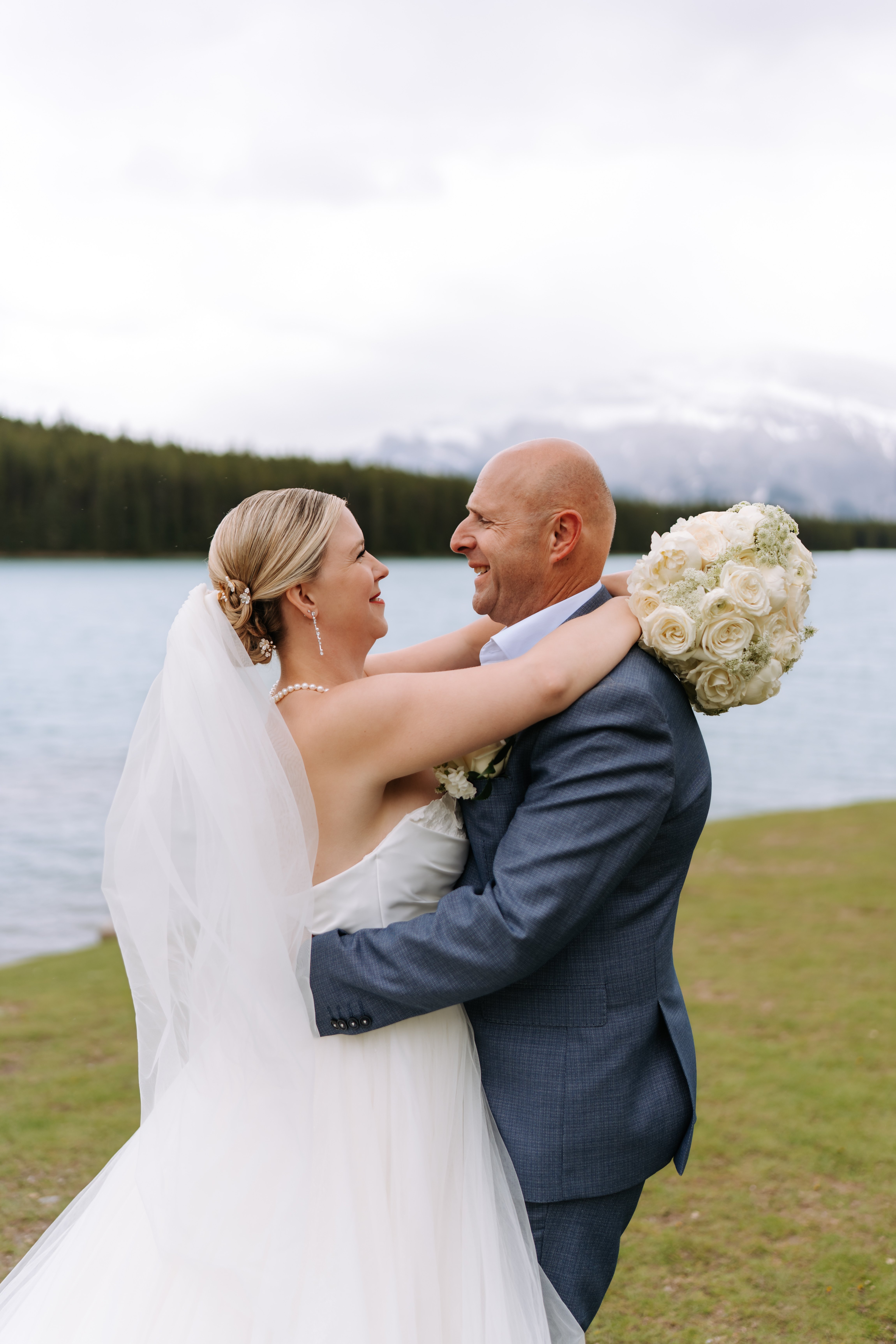 Close-up of white roses during romantic embrace