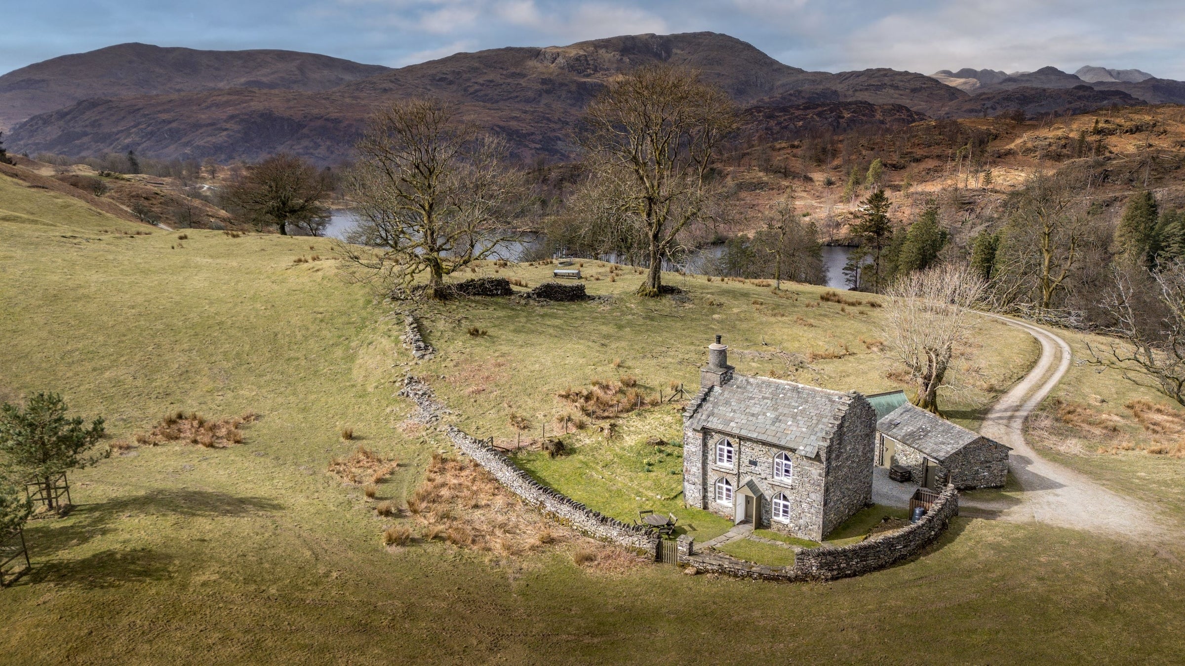 Lake District stone cottage with hills and fells