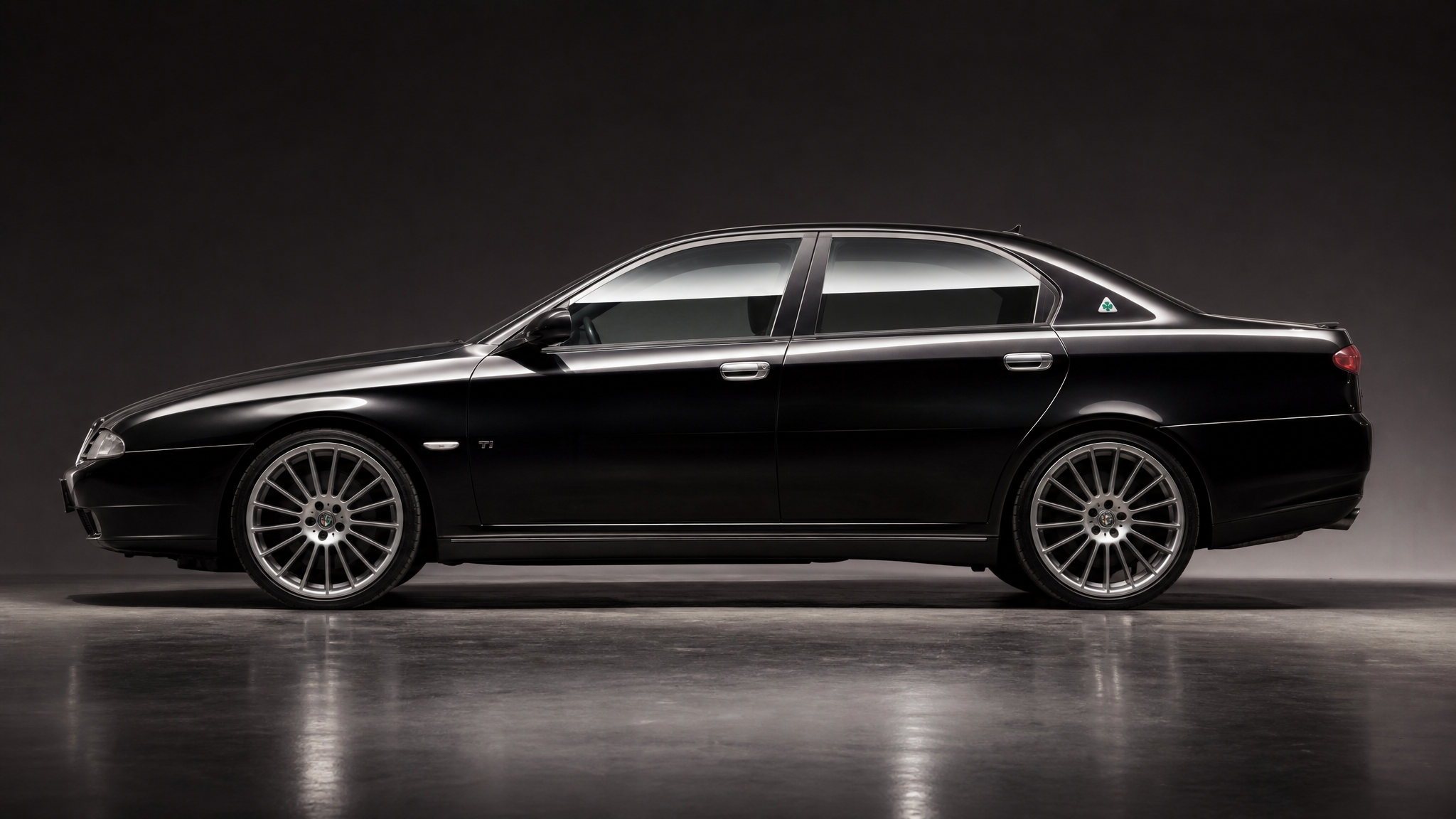 Alfa Romeo 166 Busso V6 in dramatic dark lighting