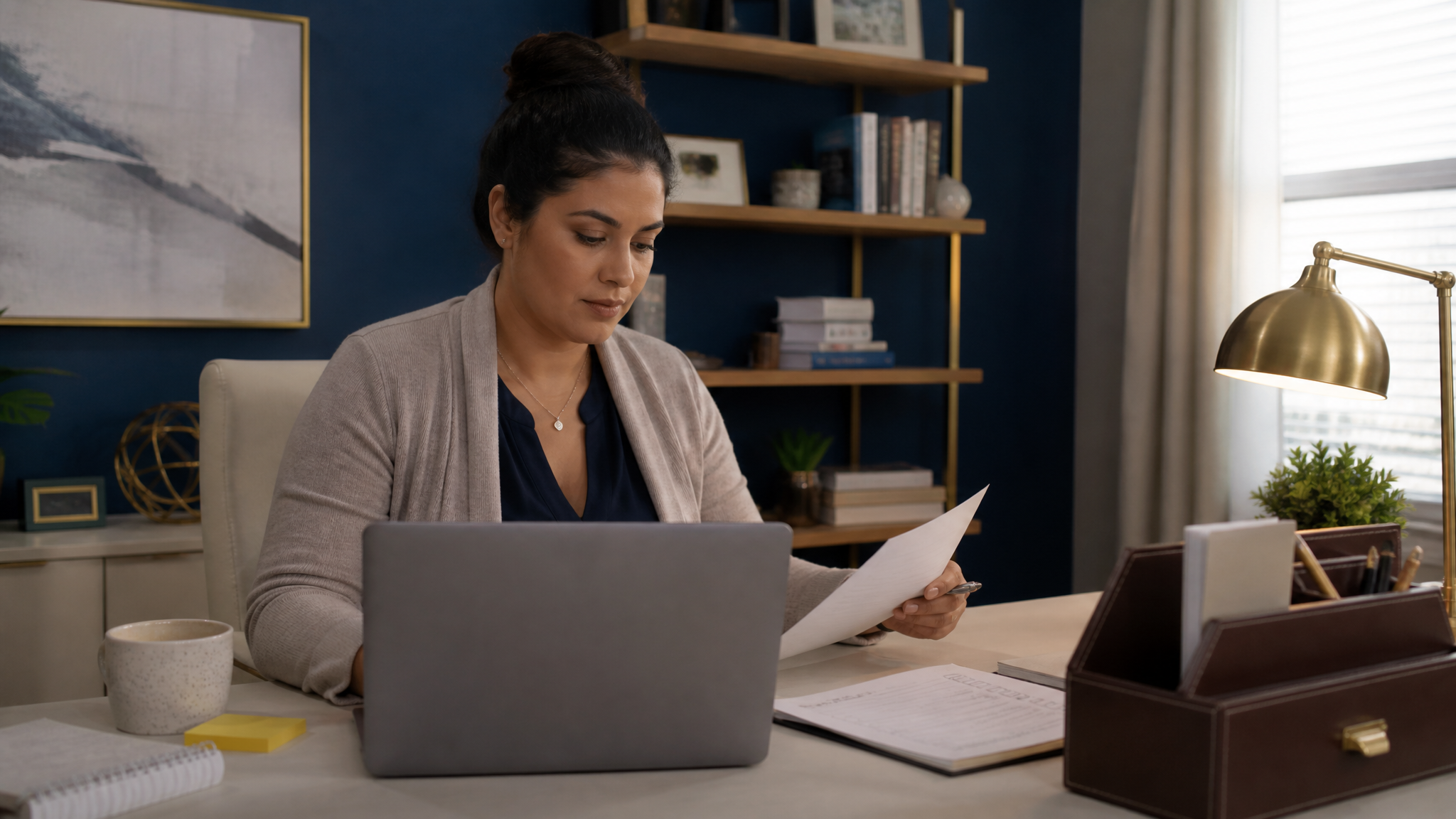 Woman veteran reviewing a benefits checklist on her laptop