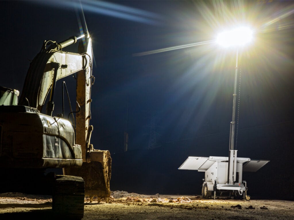Mobile lighting tower deployed at outdoor event
