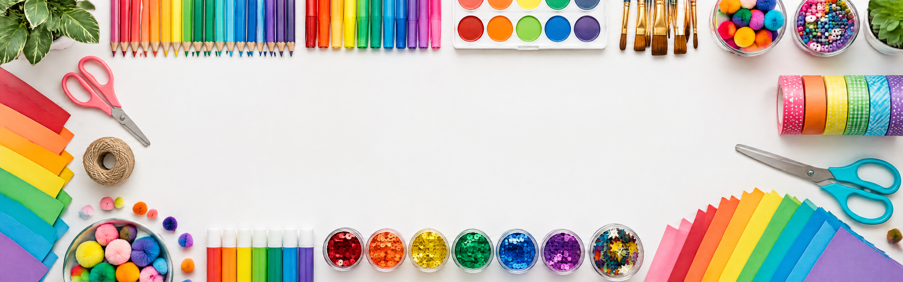 Colourful craft supplies arranged on a desk