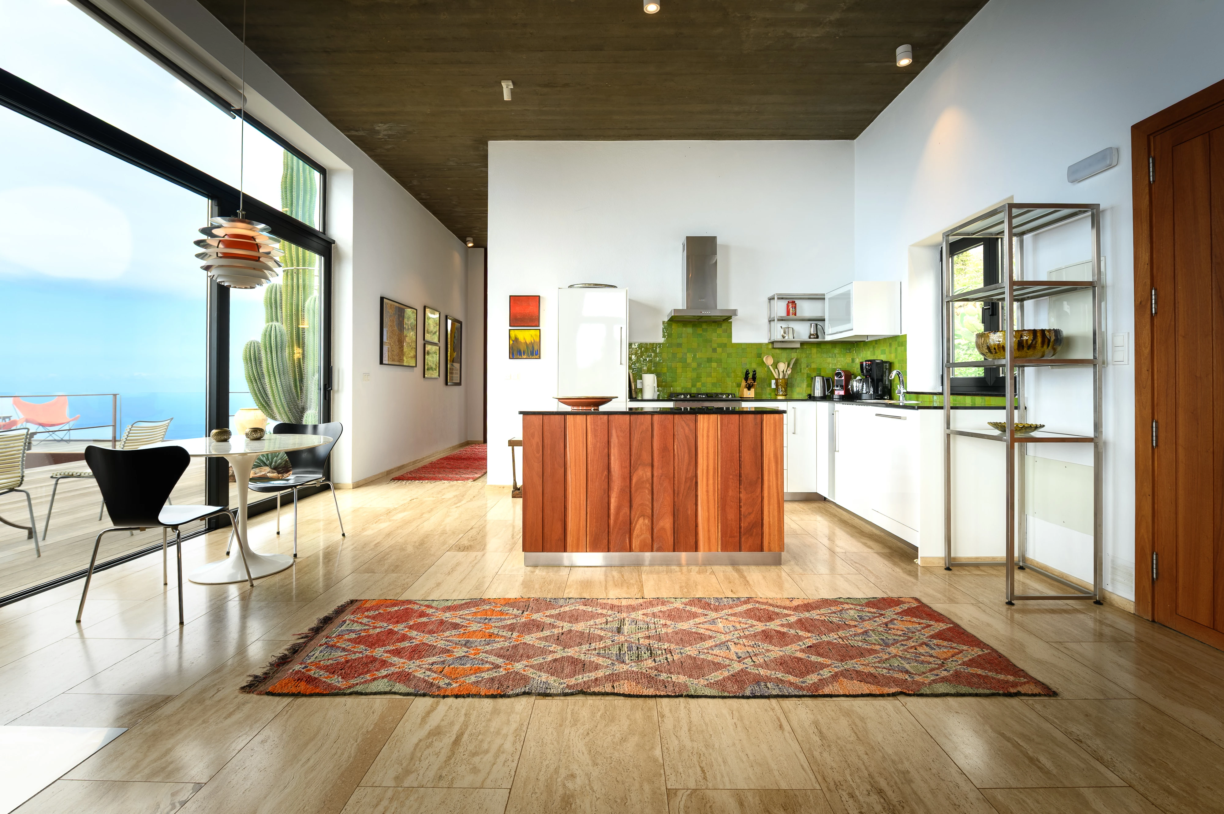 Kitchen with warm wooden cabinets and Moroccan rug