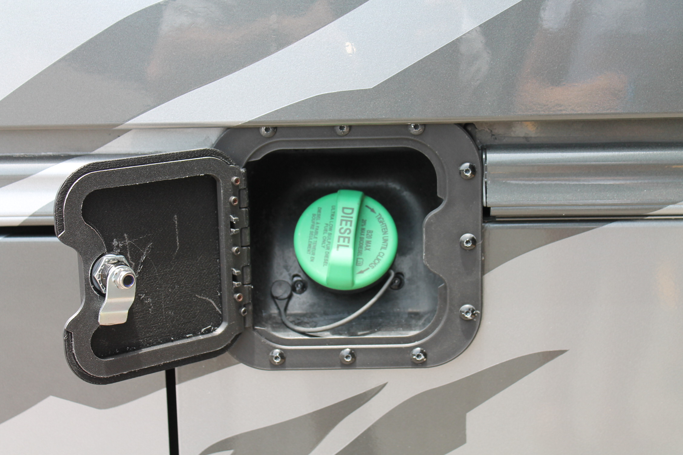 Installed fuel door — diesel cap access, wider angle