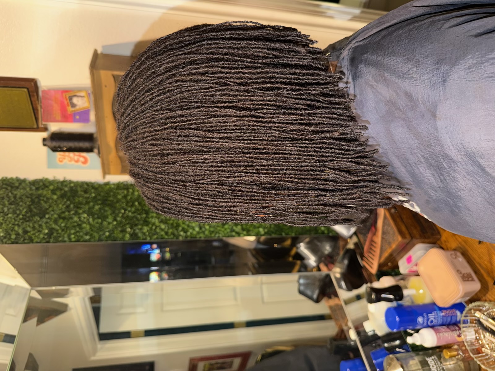 Freshly installed microlocks showing neat uniform parting and expert precision at CandieLocks salon