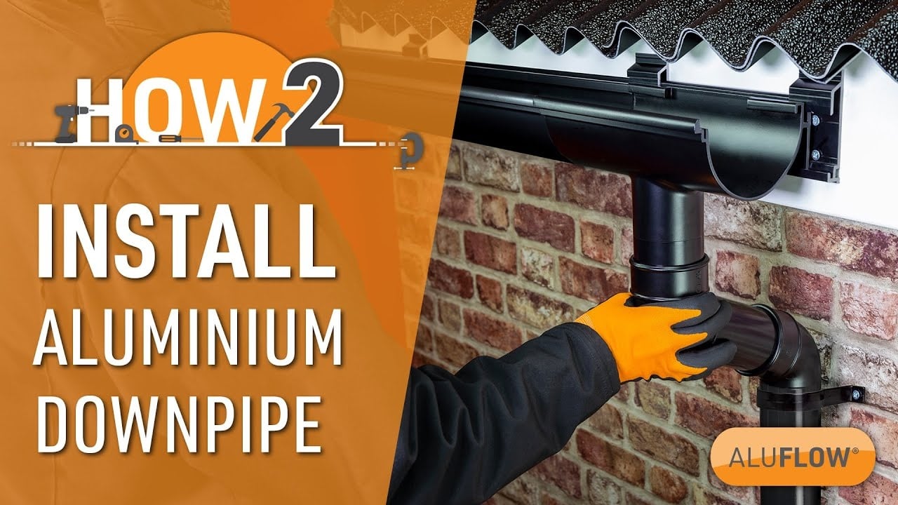 Gutter downpipe installation on a UK house