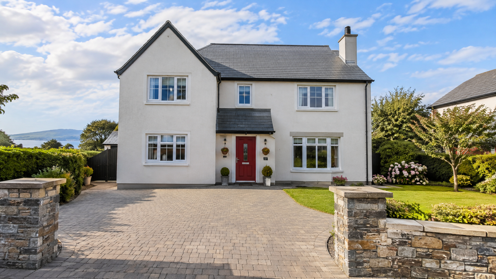 Detached Irish home with a freshly cleaned block paving driveway