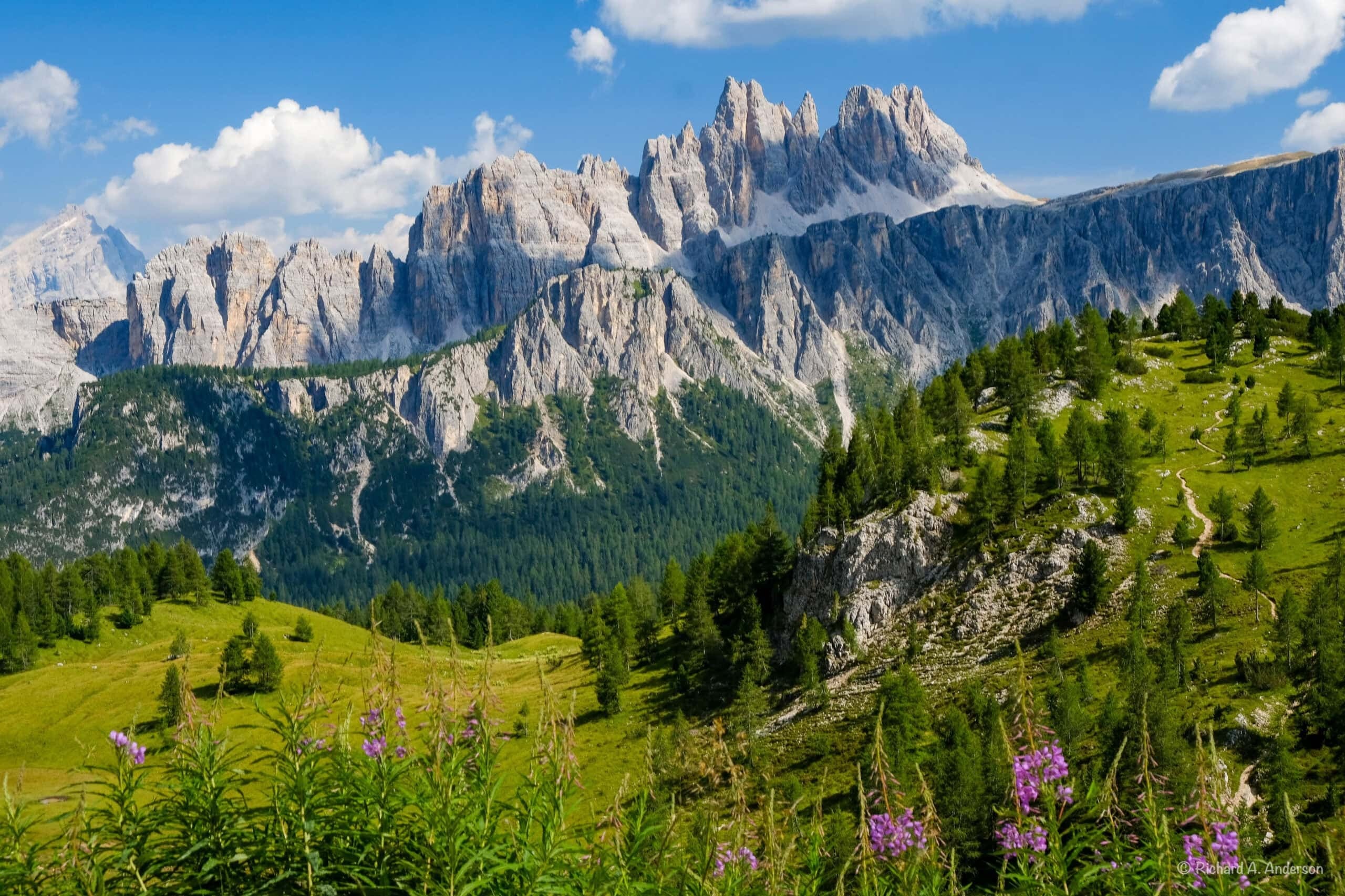 Dramatic Dolomites peaks with green valleys