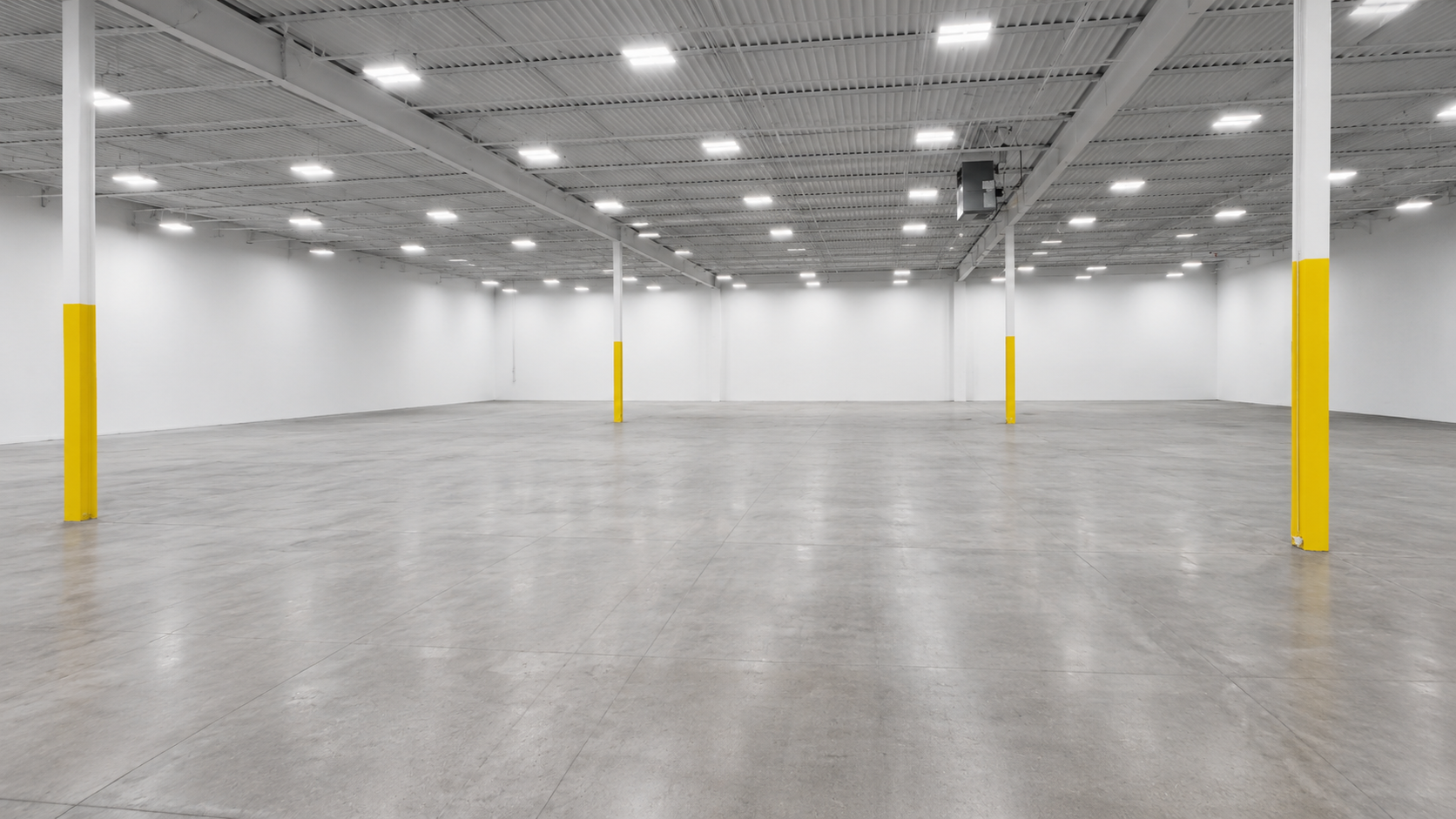 Warehouse interior with open floor plan and support columns