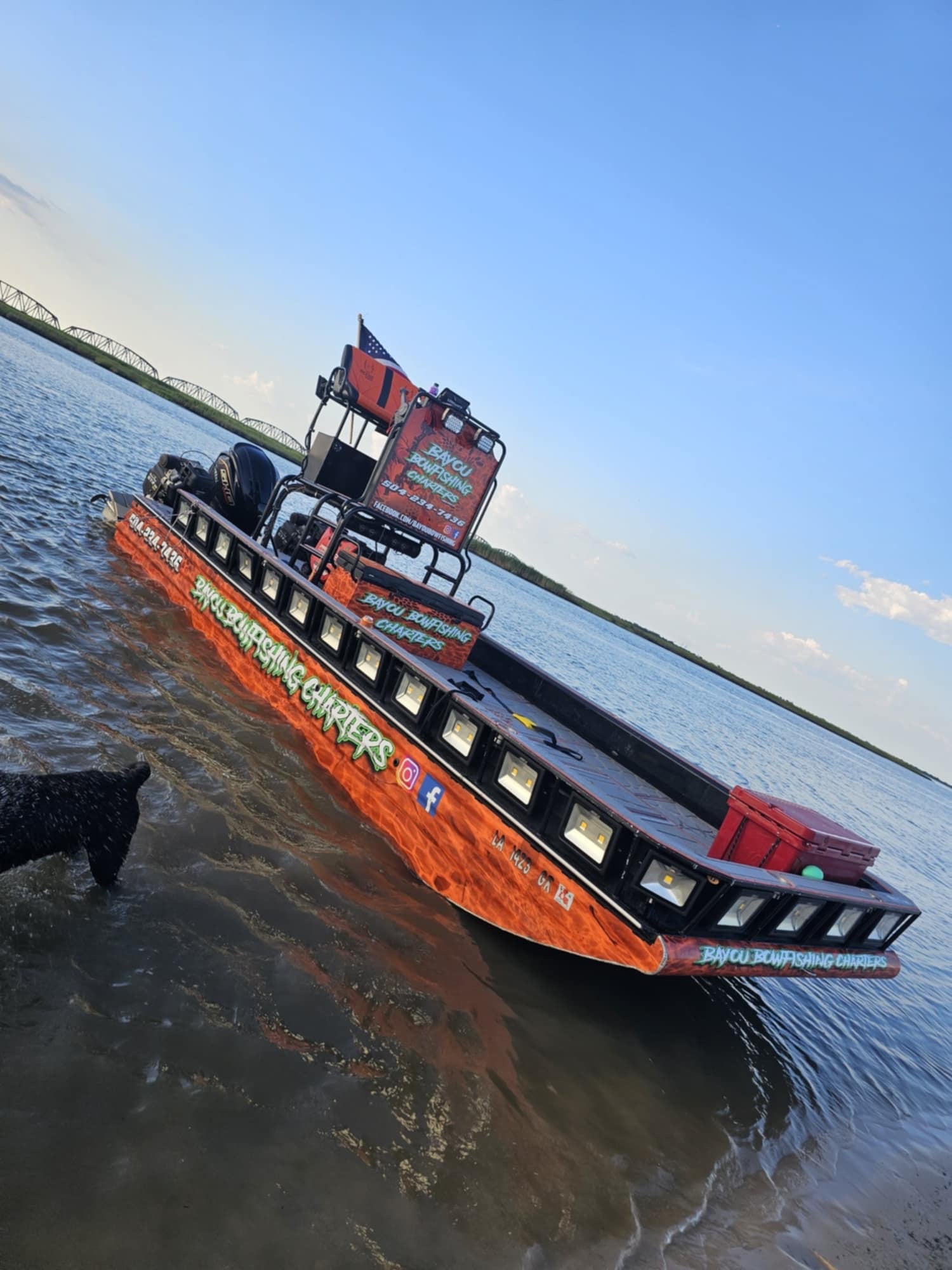 Captain navigating the Louisiana bayou on a charter