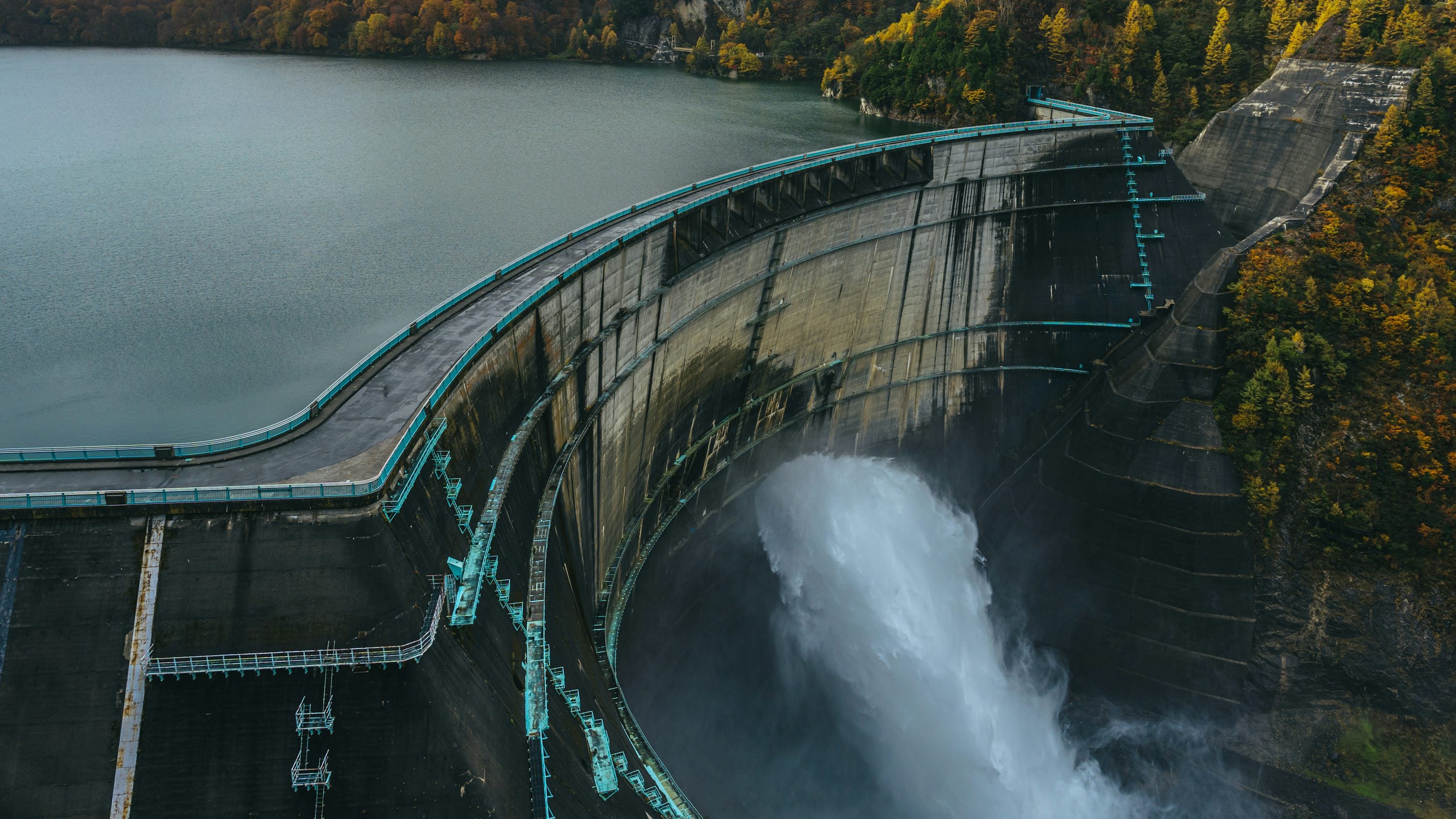 A large reservoir behind a concrete hydroelectric dam