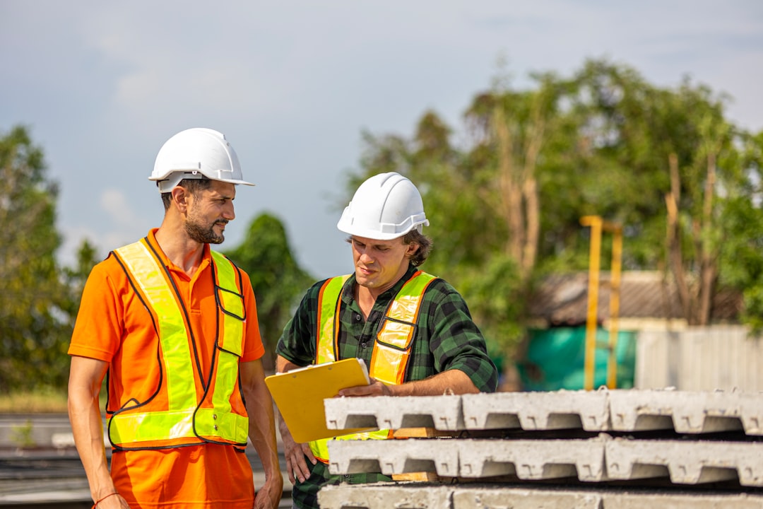 BTG construction team reviewing blueprints on a Florida jobsite