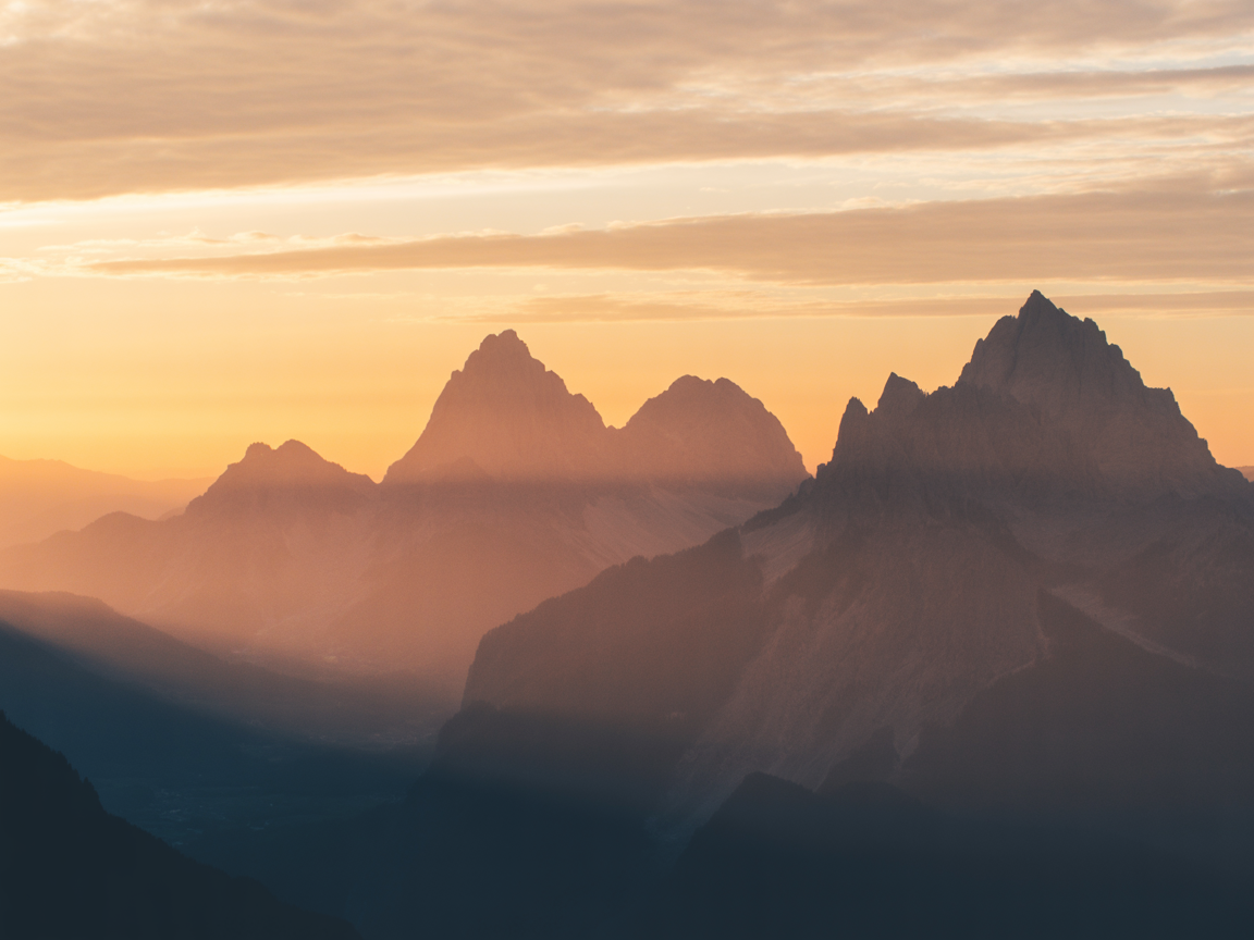Mountains with sun setting over the horizon - spiritual transformation