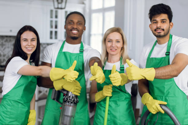 CLAPE team members providing professional laundry care