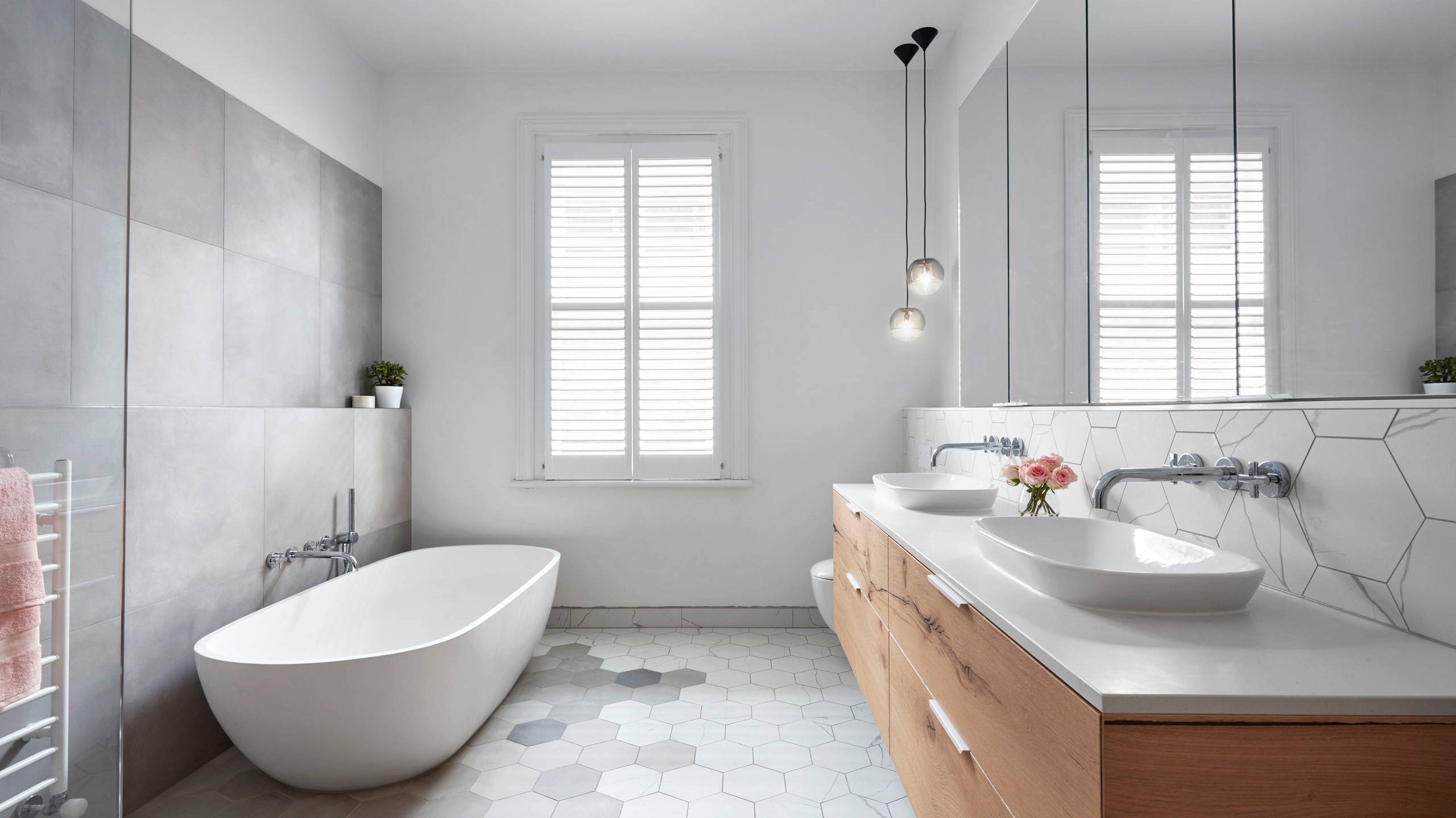 Professional bathroom remodel with modern tile work by Worldwide Floors Corp