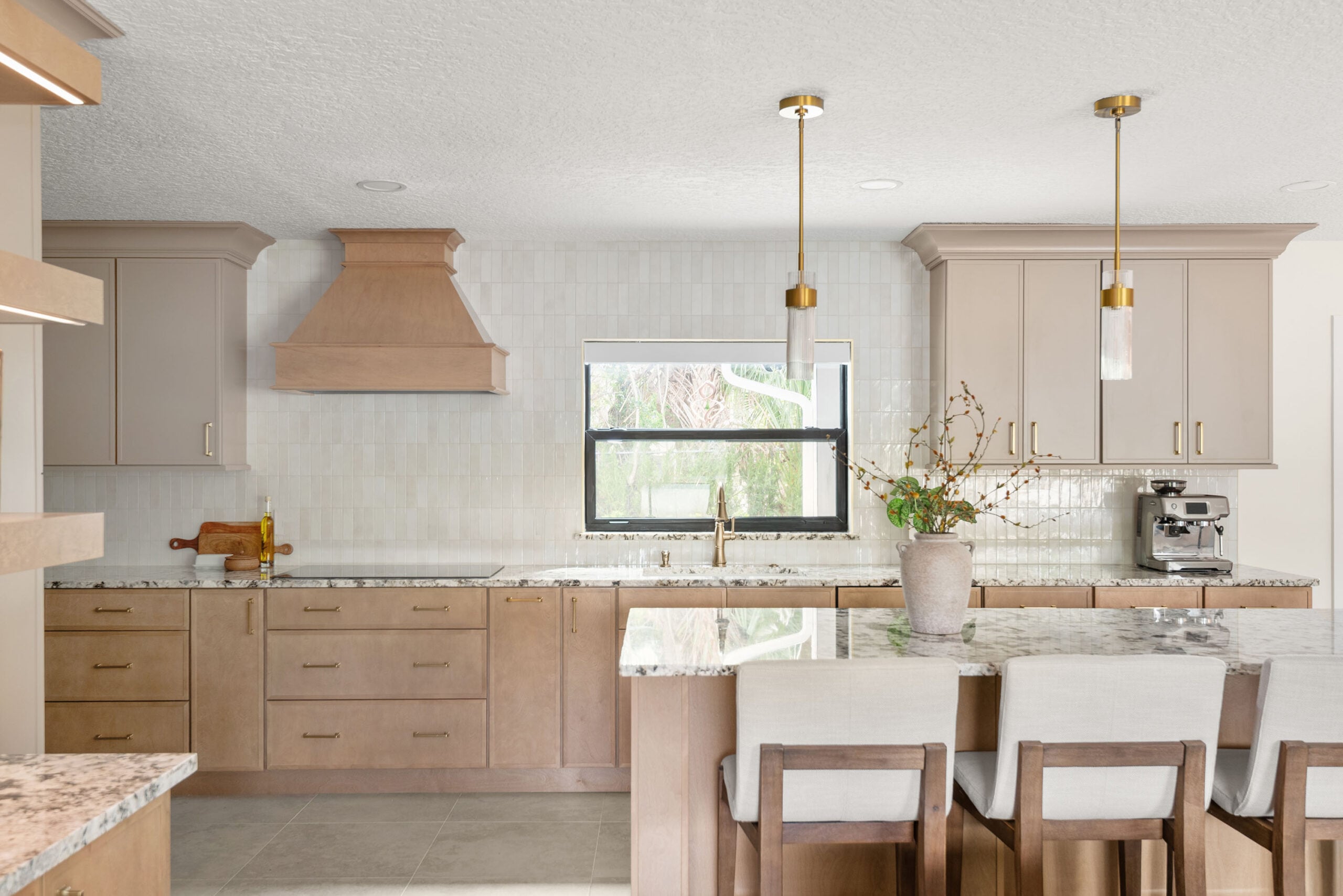 Modern remodeled kitchen with new cabinets and countertops in Miami