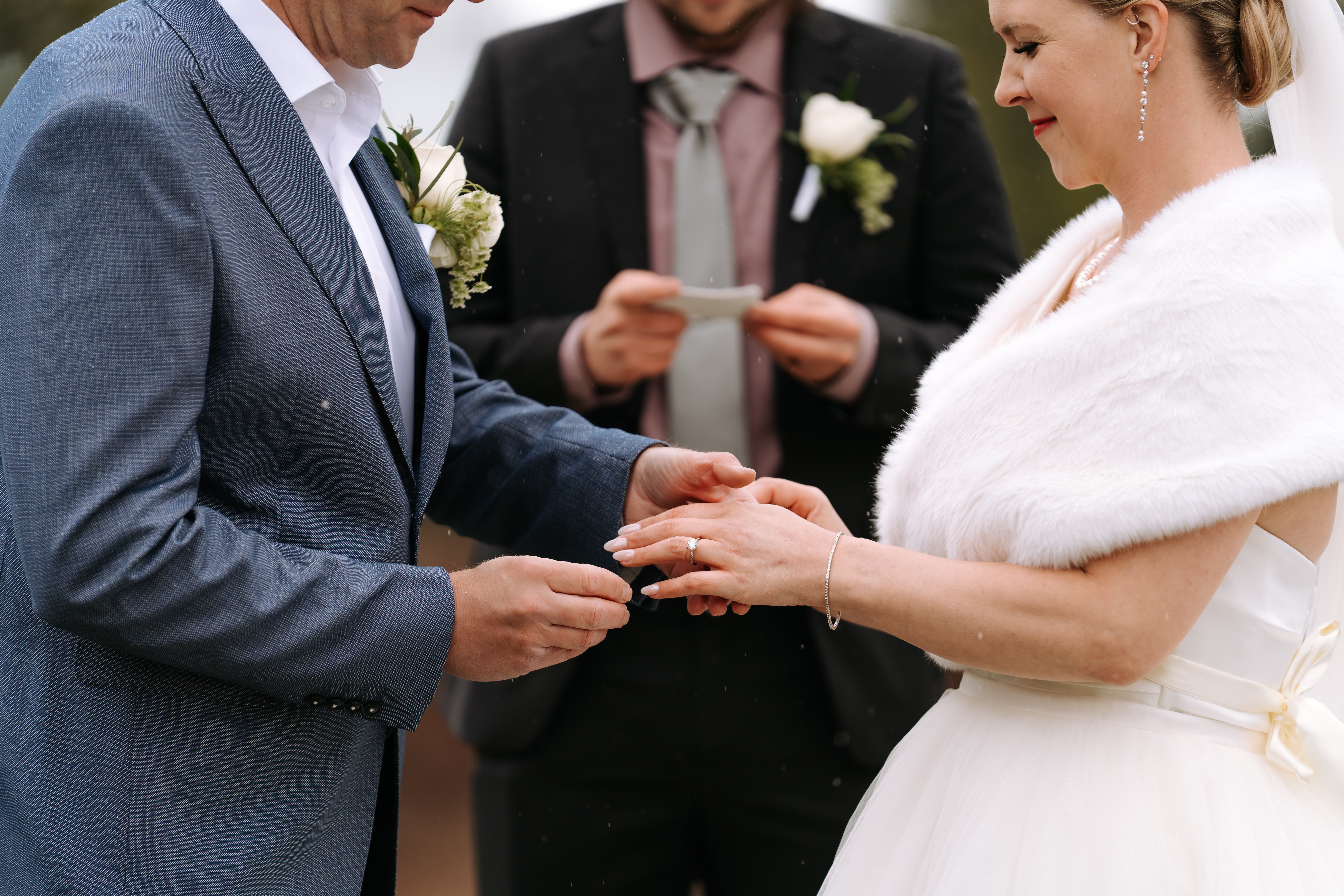 Romantic wedding kiss moment with floral details