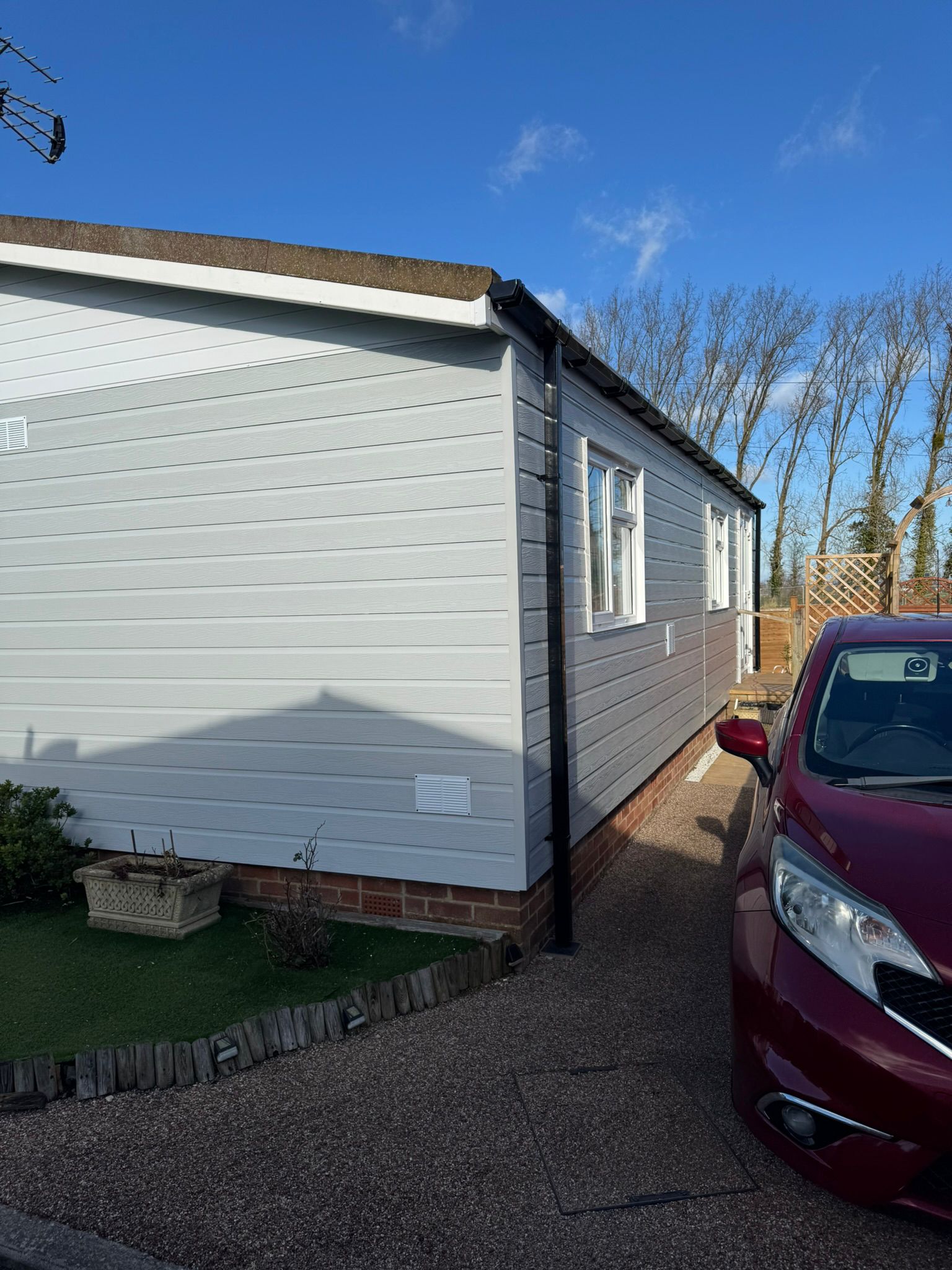 Park home exterior renovation showing completed repairs
