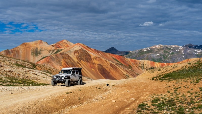 Overlanding vehicle on rugged mountain trail during Send It Tour