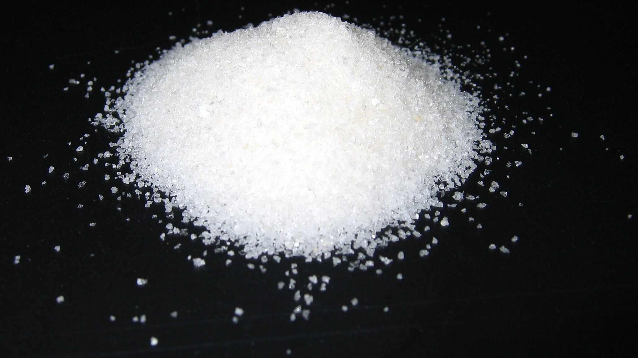 Superabsorbent polymer hydrogel beads swollen with water, translucent and glistening