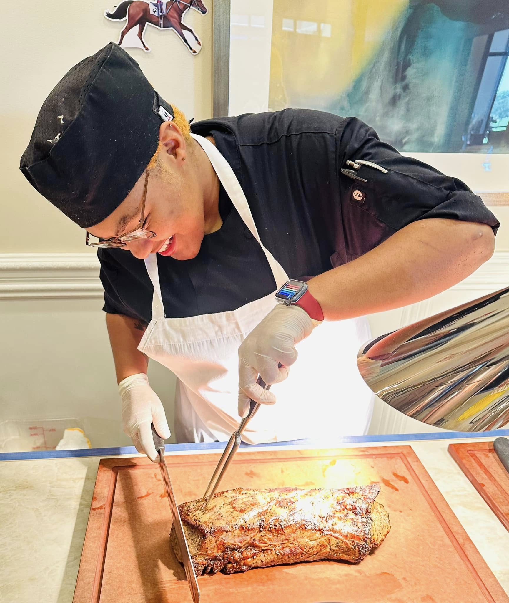 Boca Grove chef preparing gourmet cuisine in clubhouse kitchen