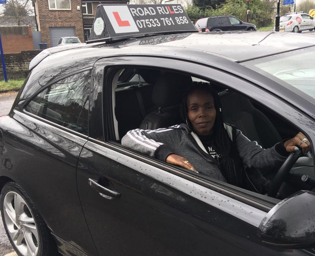 Driving instructor teaching a student