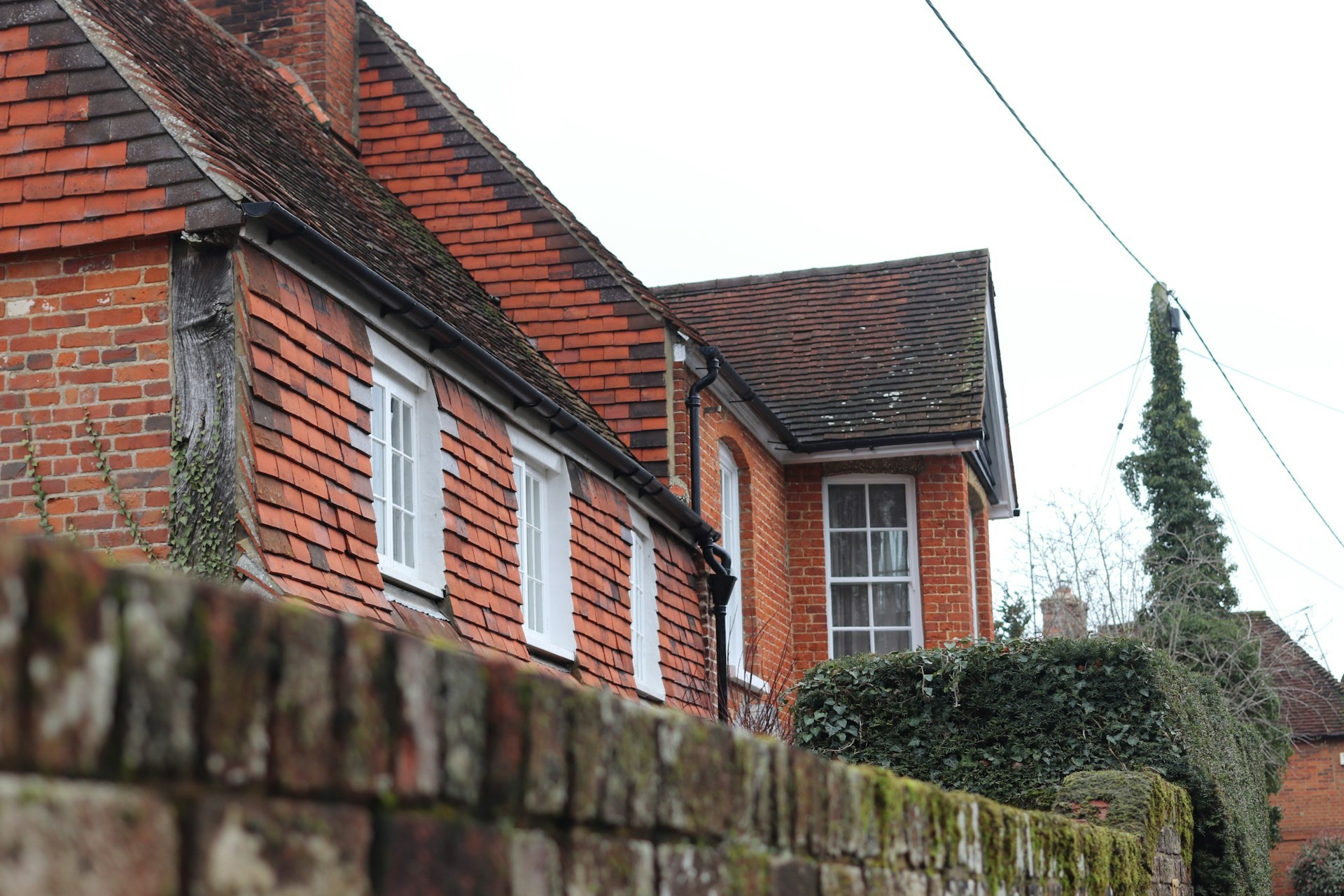 Tile-hung brick house with timber bargeboards
