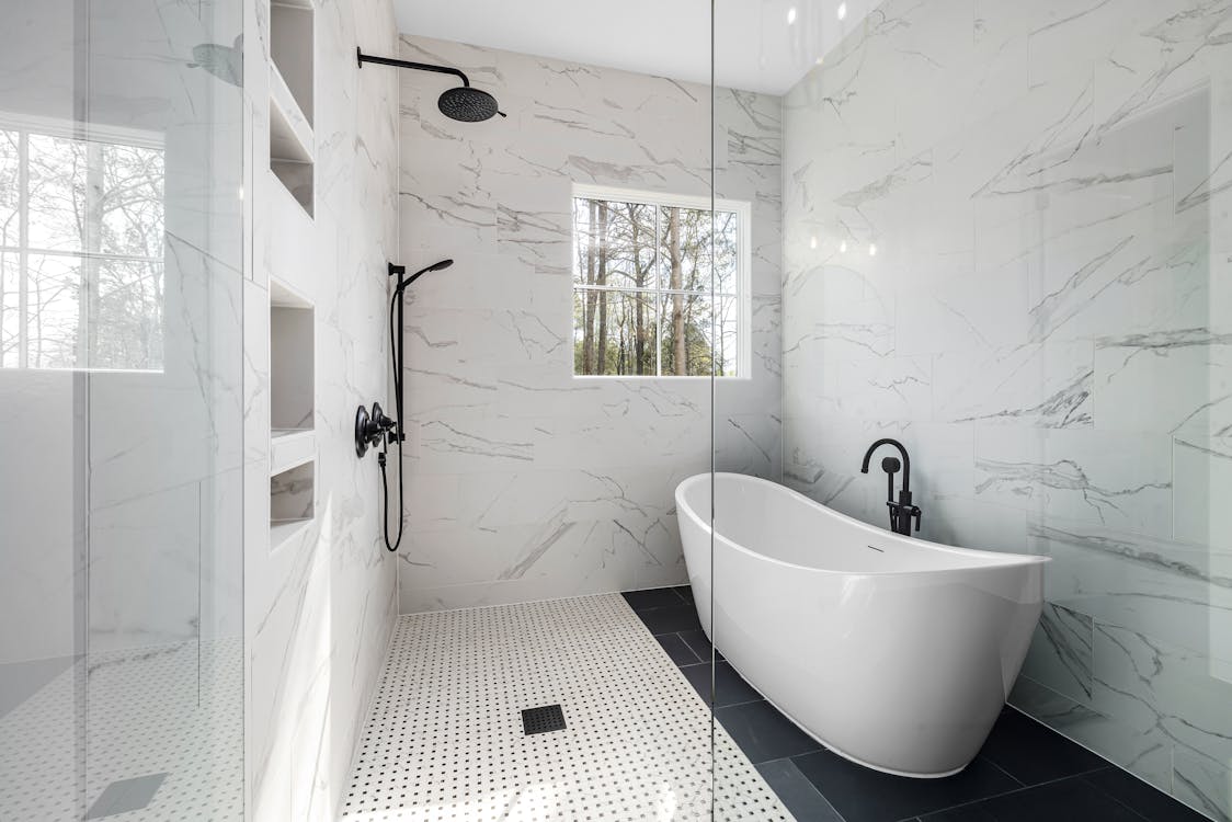 Luxury bathroom with freestanding tub and marble