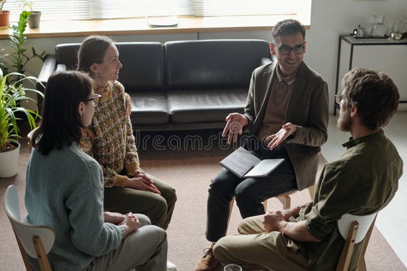 Group therapy session with supportive community