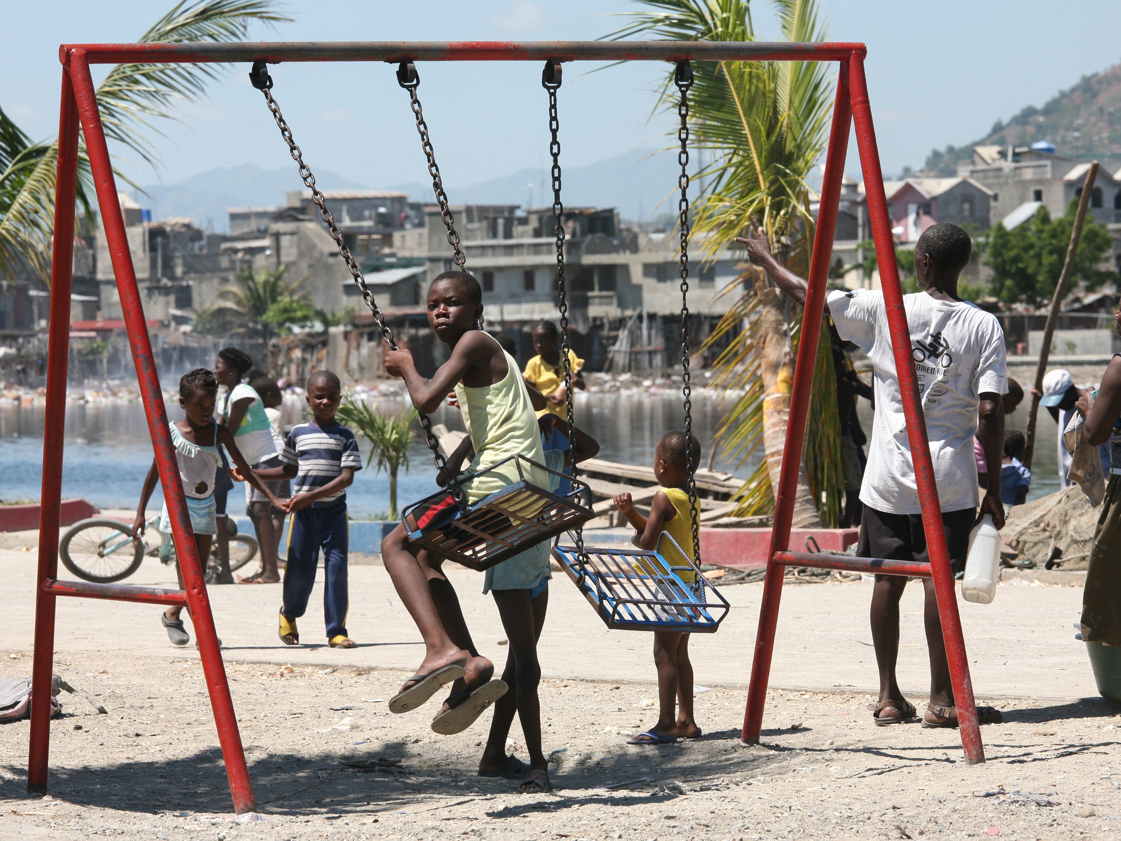 Haitian children playing outdoors in a village