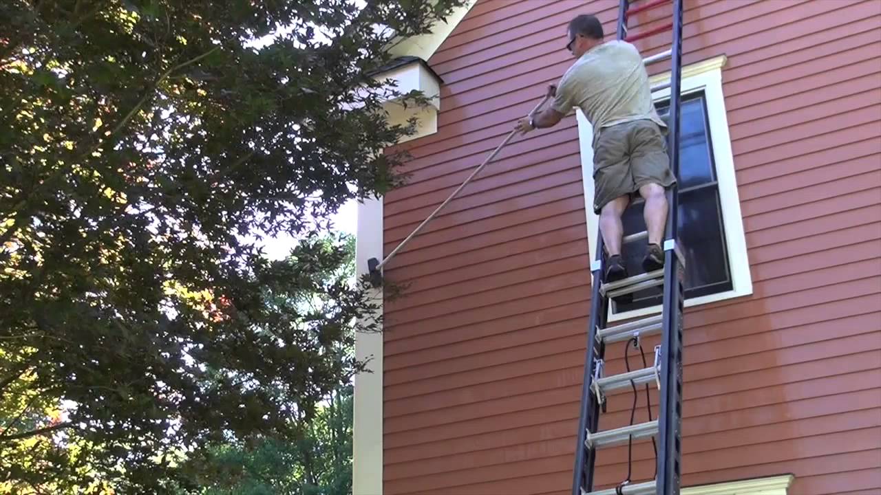 Professional pressure washing service cleaning residential property exterior