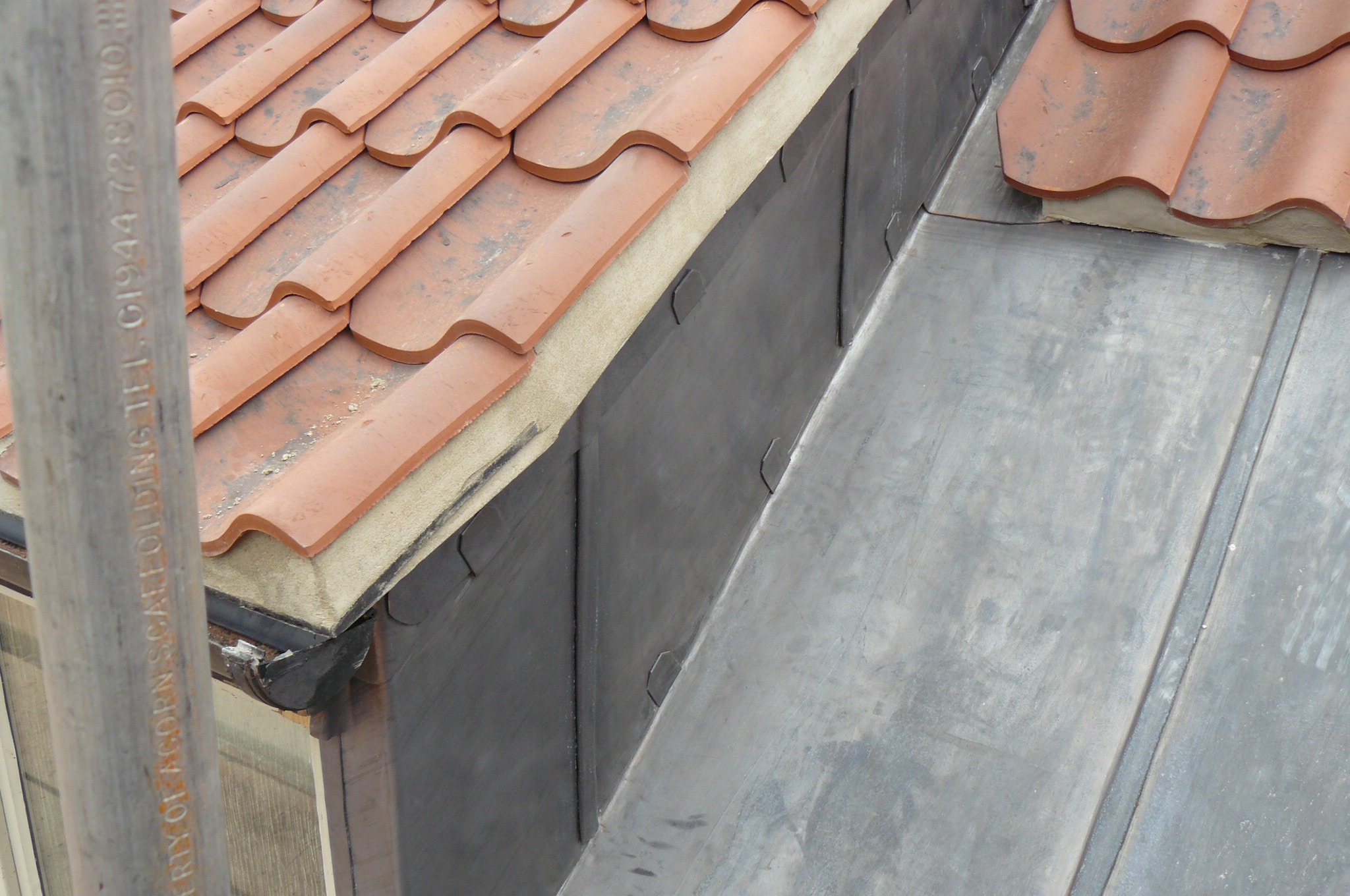 Ridge tiles being fitted on a new roof installation